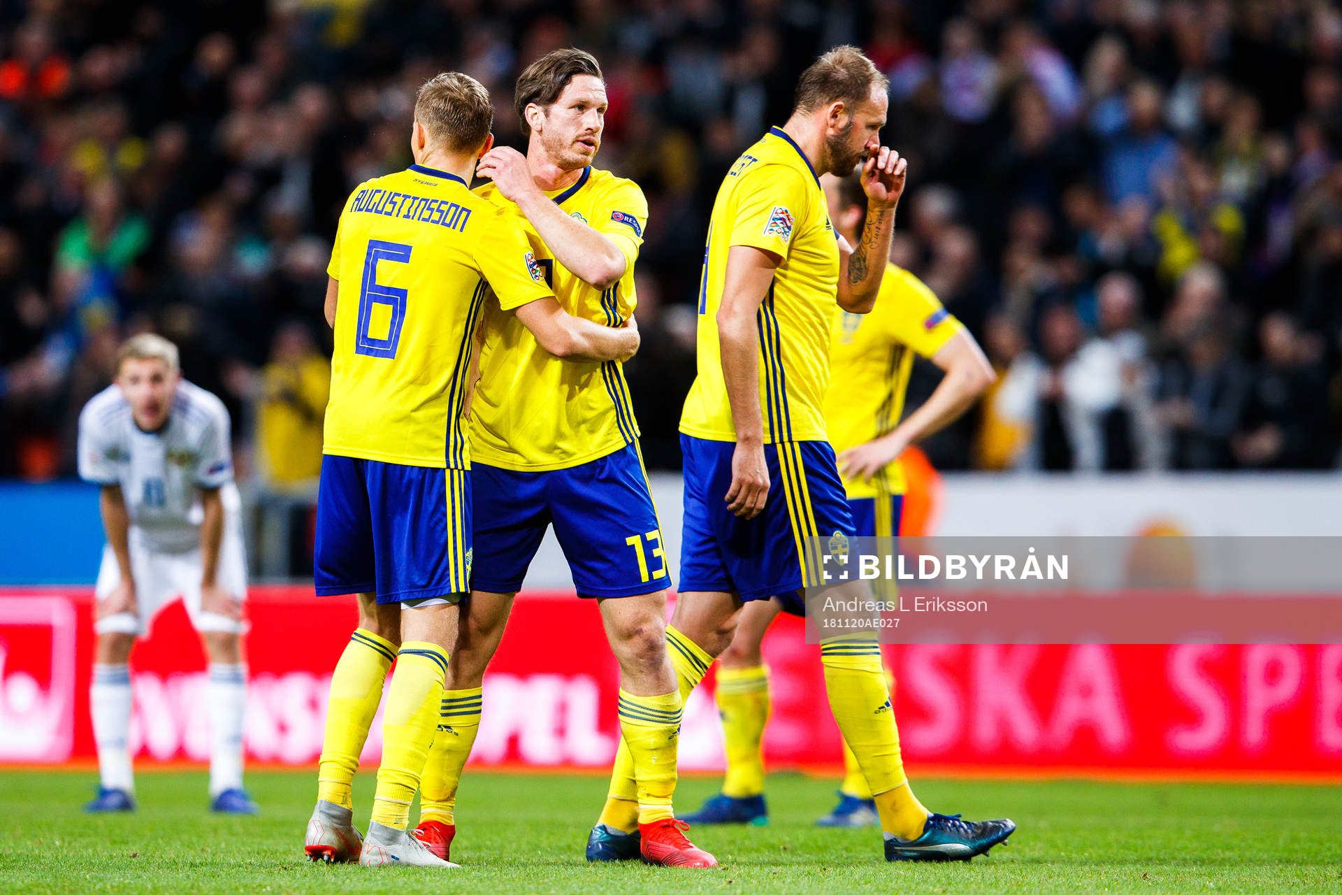 Ludwig Augustinsson, Gustav Svensson and Andreas Granqvist of Sweden celebrate after the Nations League football match between Sweden and Russia on November 20, 2018 in Stockholm.