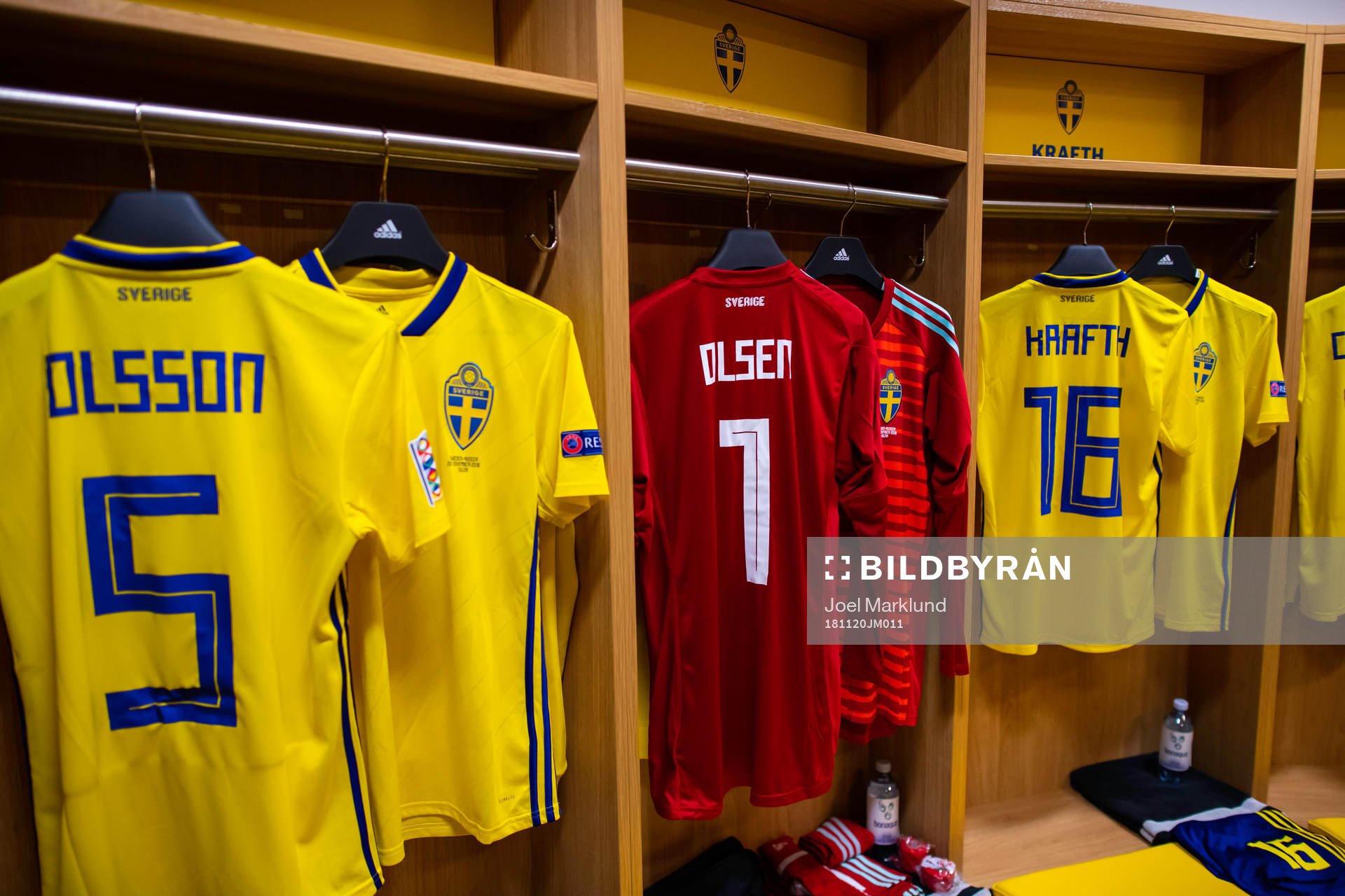 The jerseys of Martin Olsson, goalkeeper Robin Olsen and Emil Krafth in team Sweden's dressing room prior to the Nations League football match between Sweden and Russia on November 20, 2018 in Stockholm.