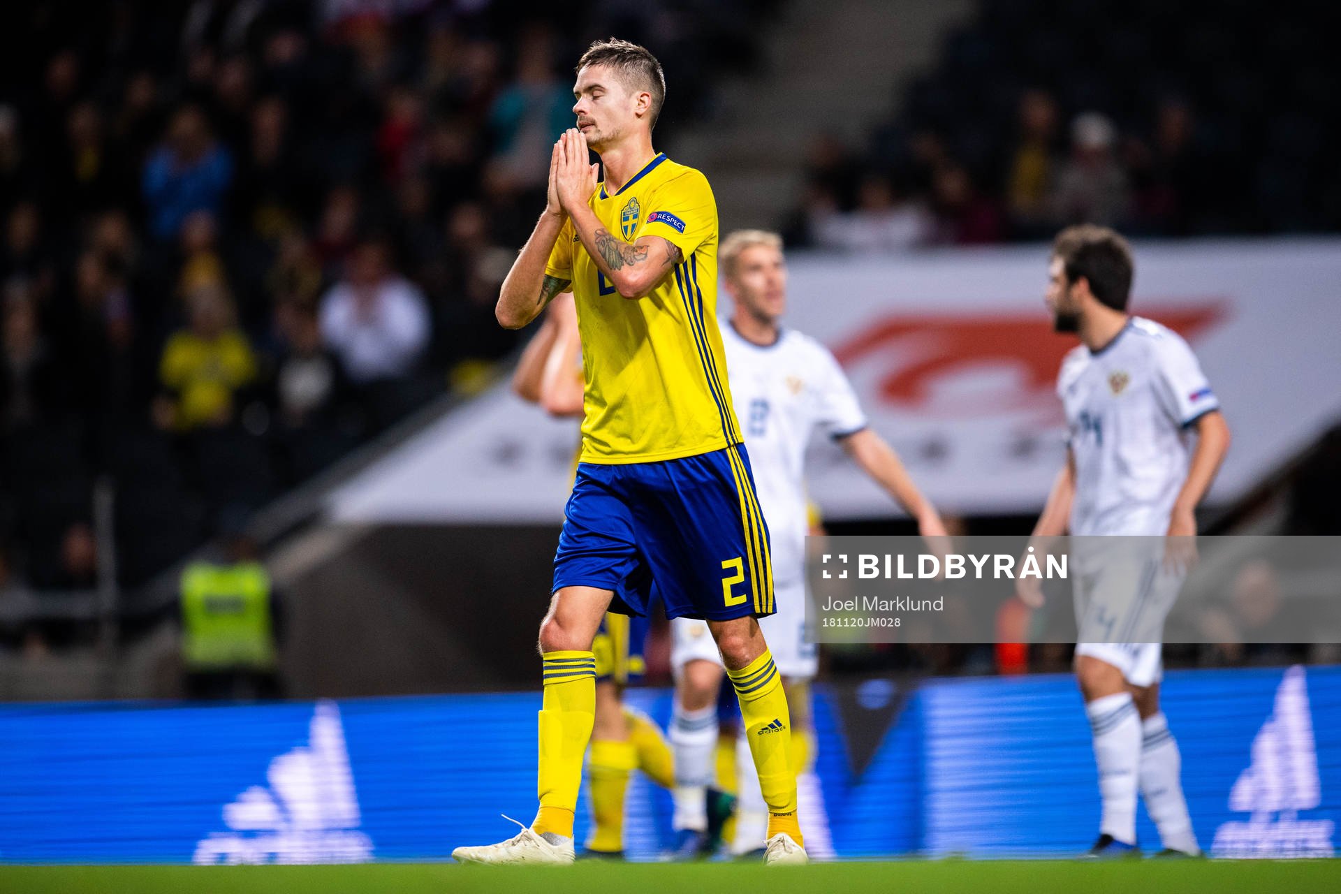 Mikael Lustig of Sweden looks dejected