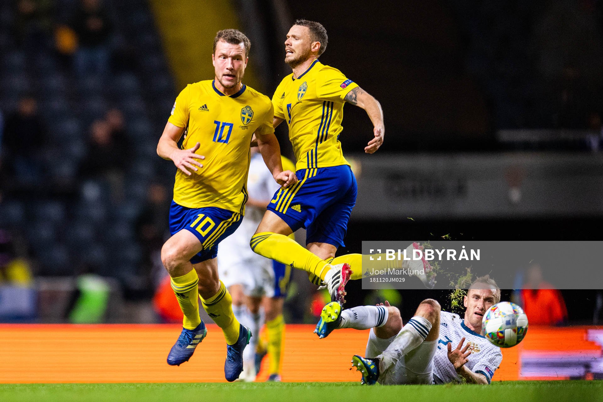Jakob Johansson and Marcus Berg of Sweden in a duel with
