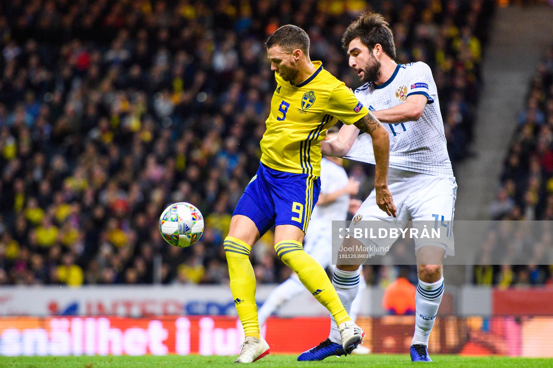 Marcus Berg of Sweden and Giorgi Dzhikiya of Russia