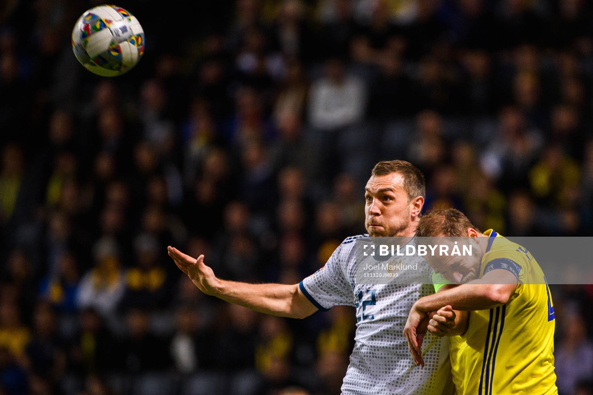 Artem Dzyuba of Russia and Andreas Granqvist of Sweden