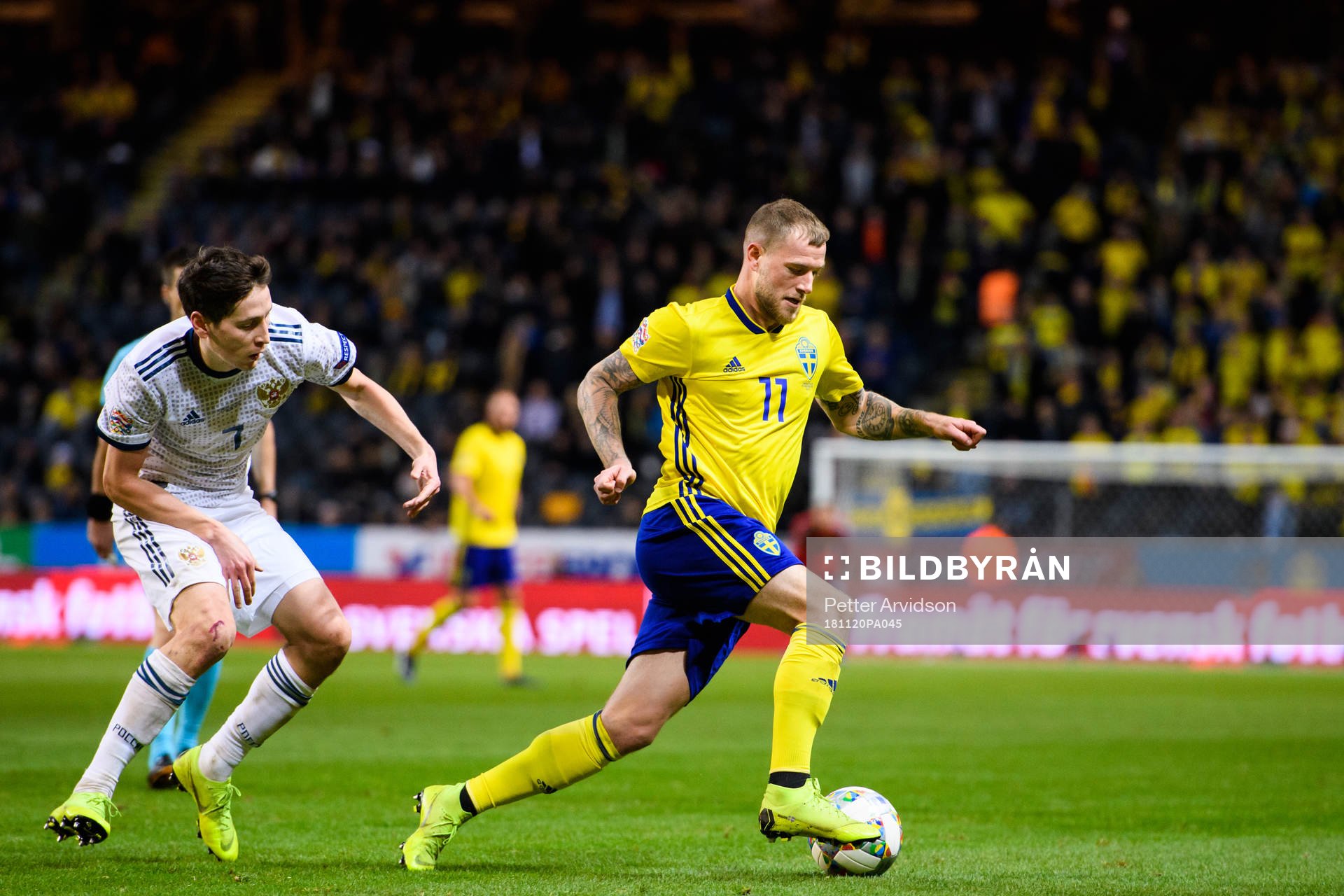 Daler Kuziaev of Russia and John Guidetti of Sweden