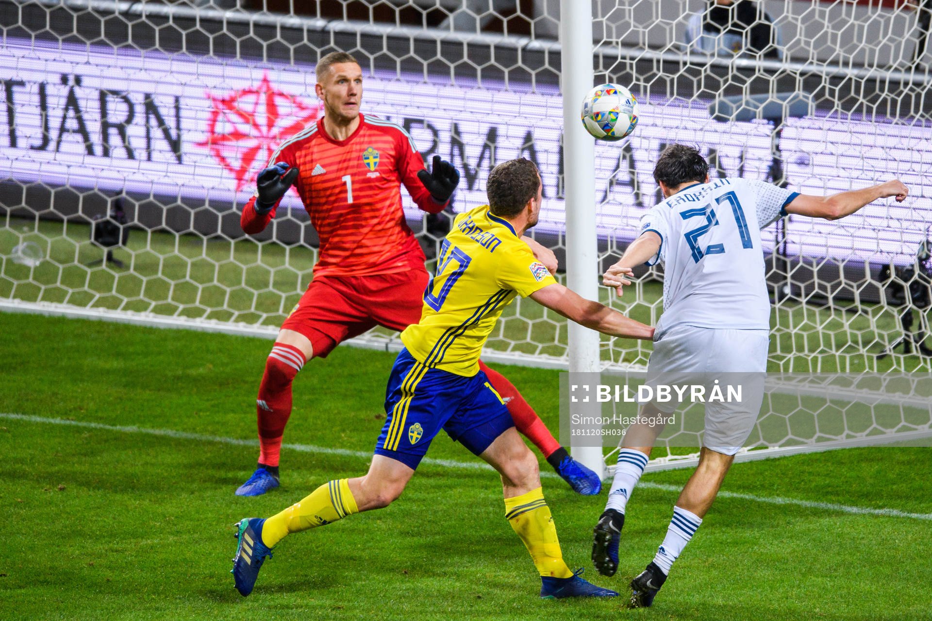 Aleksandr Erokhin of Russia in a duel with goalkeeper Robin