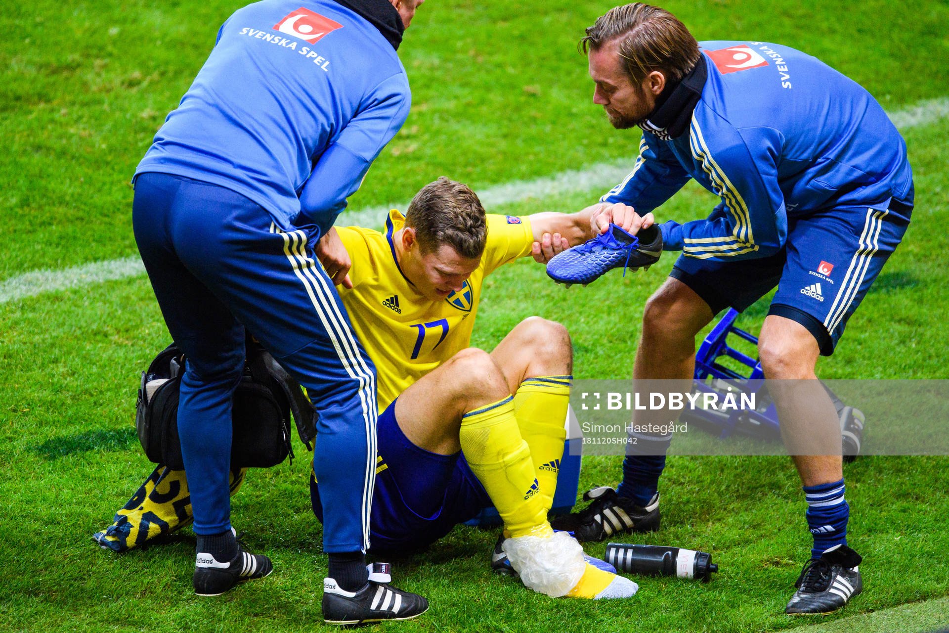Viktor Claesson of Sweden receives help