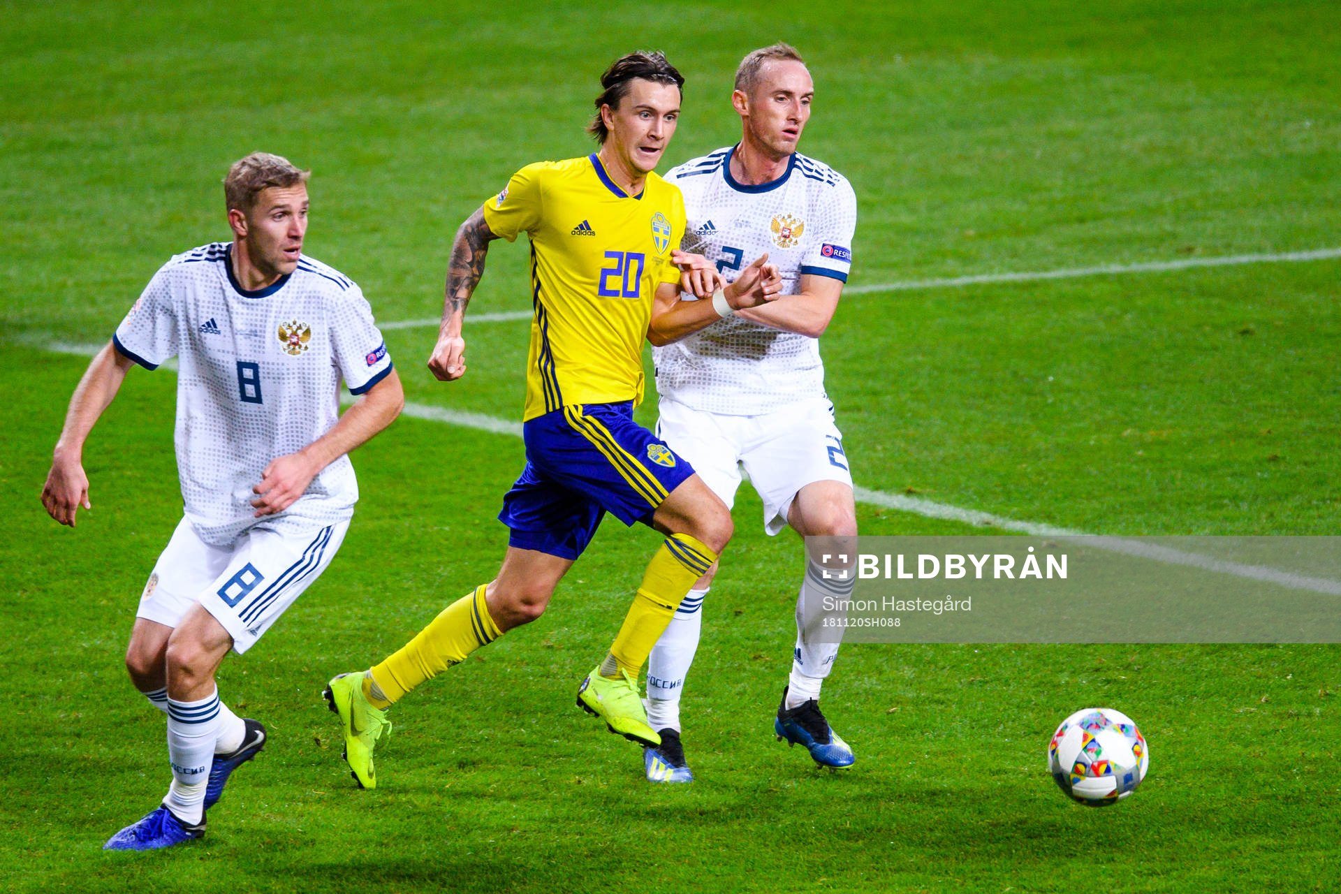 Iury Gazinsky and Vladislav Ignatyev  of Russia against Kristoffer Olsson of Sweden during the Nations League football match between Sweden and Russia on November 20, 2018 in Stockholm.