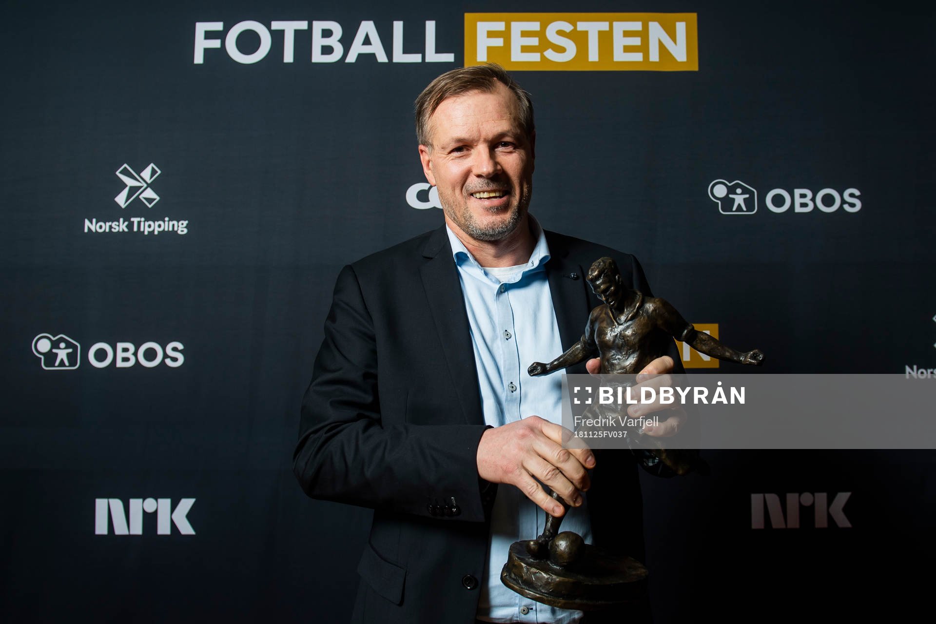 Kjetil Rekdal of Start poses for a portrait with the award