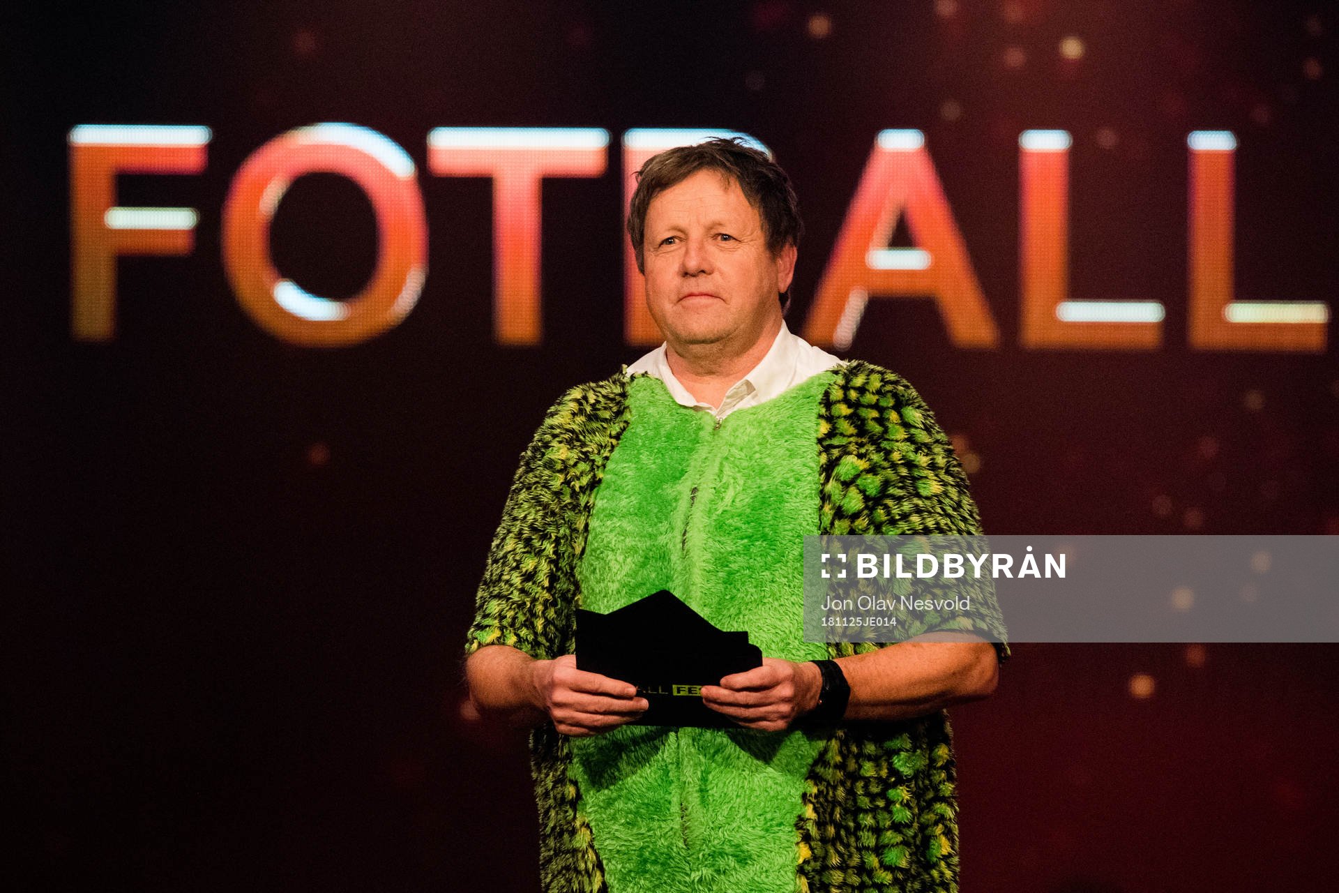 Bjarne Berntsen, coach of Viking, in a dinosaur costume