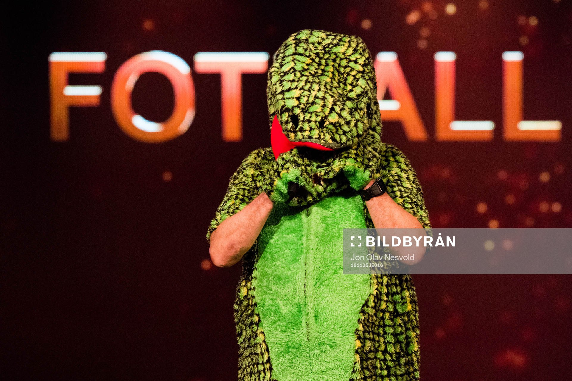 Bjarne Berntsen, coach of Viking, in a dinosaur costume