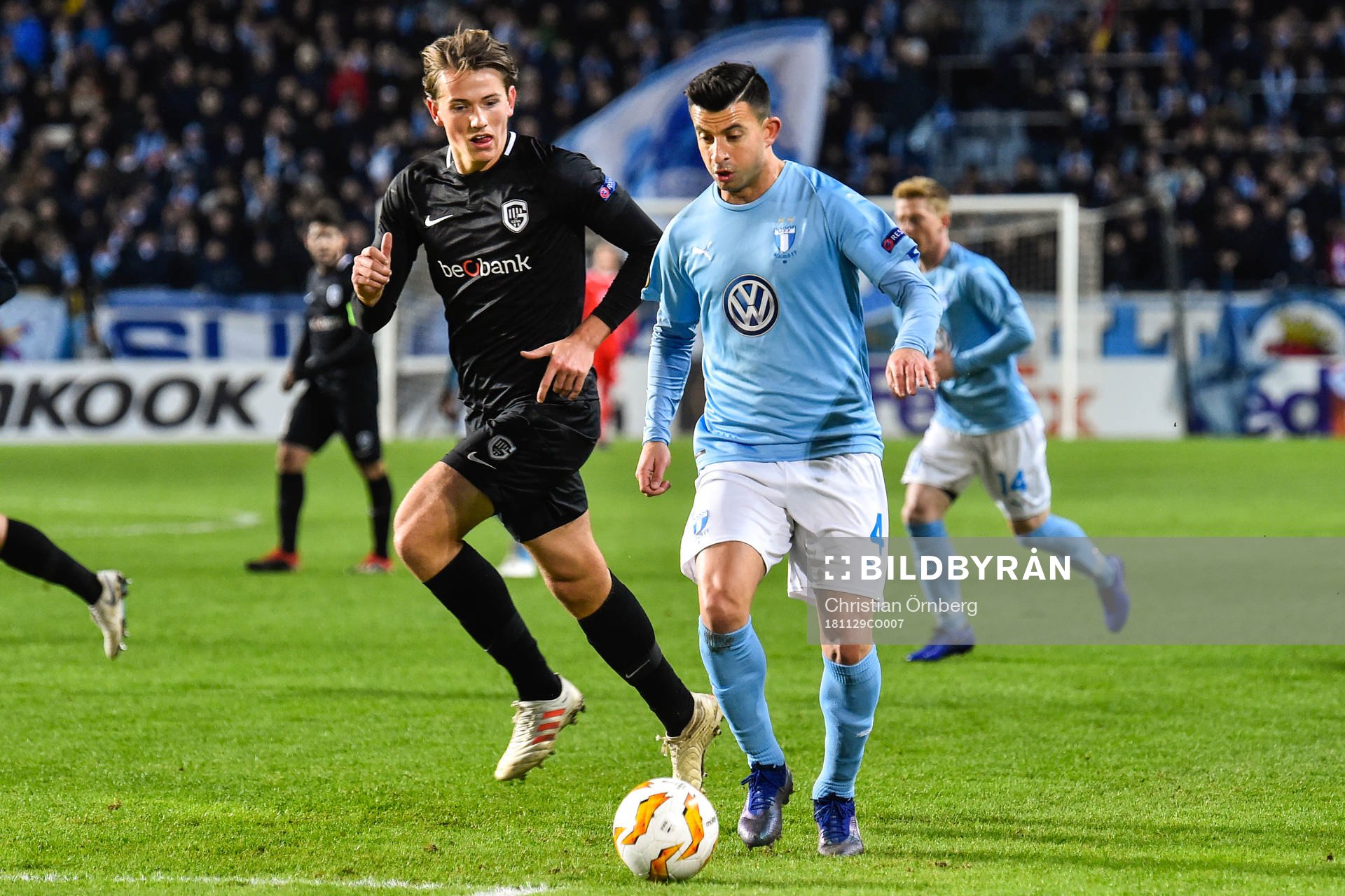 Sander Berge of Genk and Behrang Safari of Malmö FF