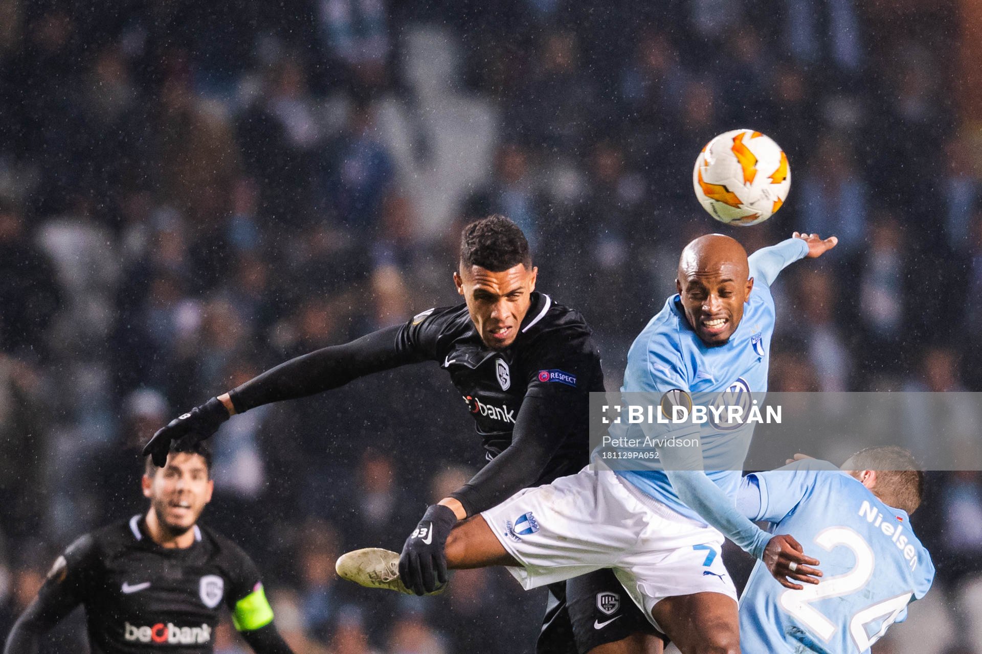 Zinho Gano of Genk in a duel with Fouad Bachirou of Malmö