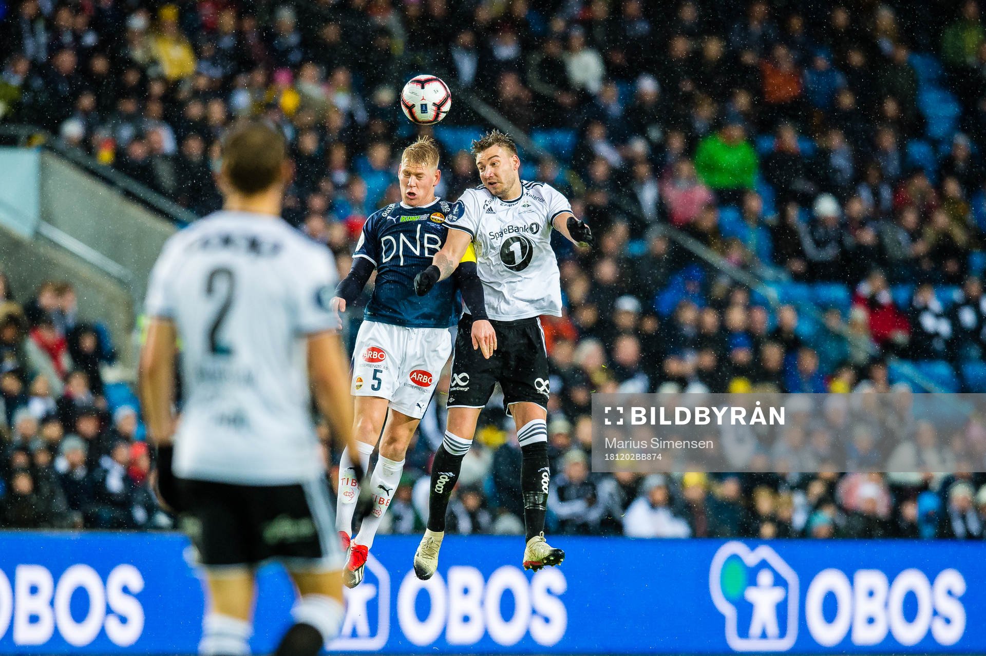 Jakob Glesnes of Strømsgodset and Nicklas Bendtner of