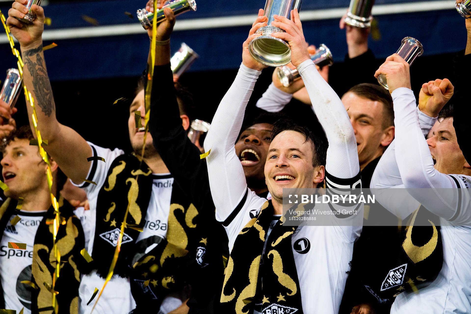 Mike Jensen of Rosenborg lifts the trophy