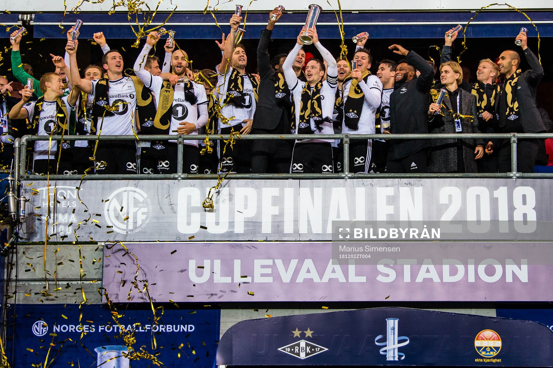 Mike Jensen of Rosenborg lifts the trophy