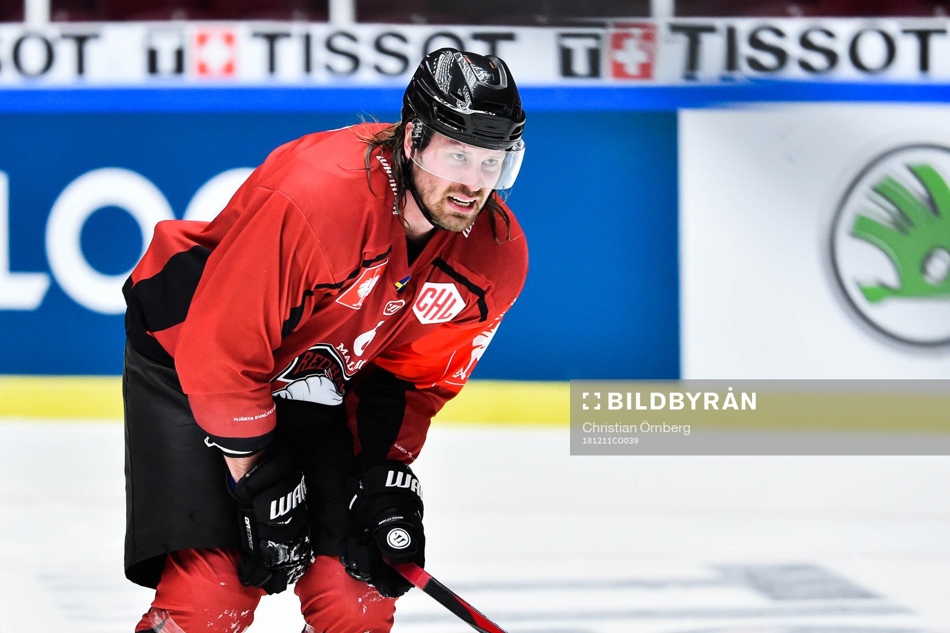 Stefan Warg of Malmö Redhawks reaches for his knee