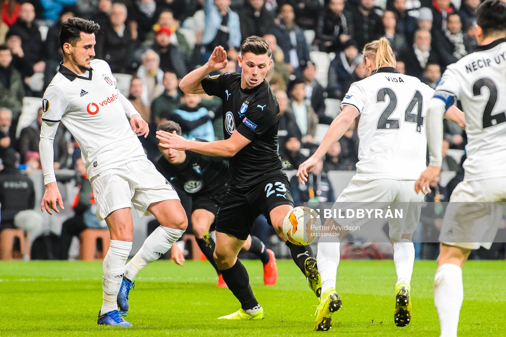 Marcus Antonsson of Malmö FF in a duel with Mustafa Pektemek and Domagoj Vida of Besiktas during the Europa league match between Besiktas and Malmö FF on December 13, 2018 in Istanbul.