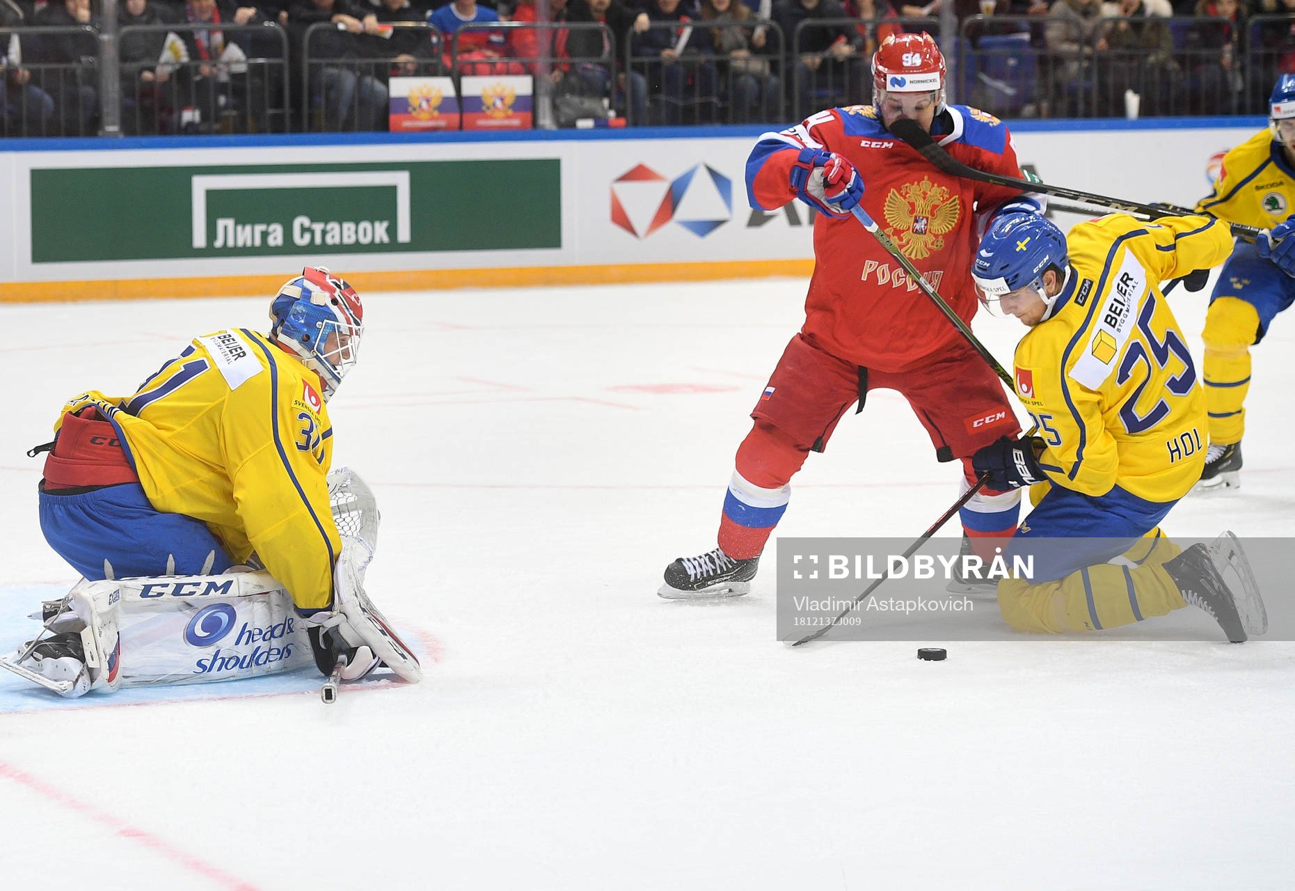 Sweden's goalie Lars Johansson, left, and Philip Holv,
