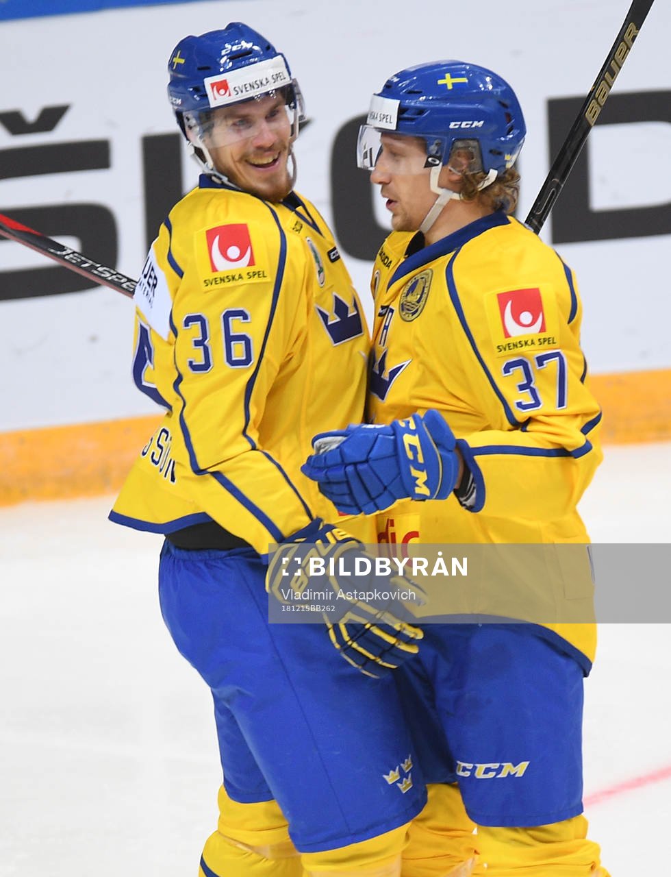 Sweden's Emil Larsson, left, celebrates his goal with John