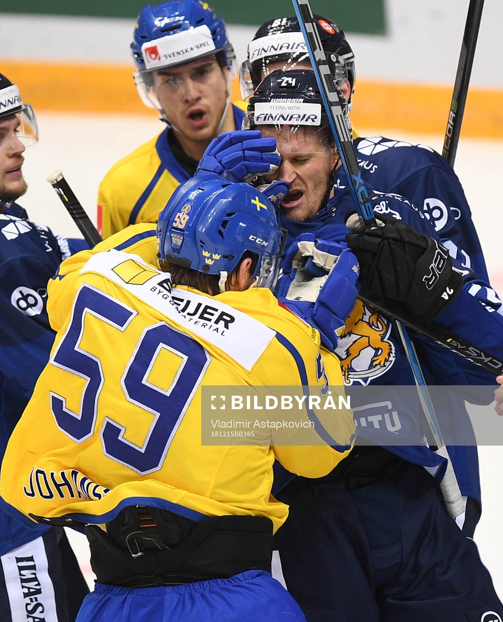 Sweden's Linus Johansson, left, and Finland's Jani Lajunen
