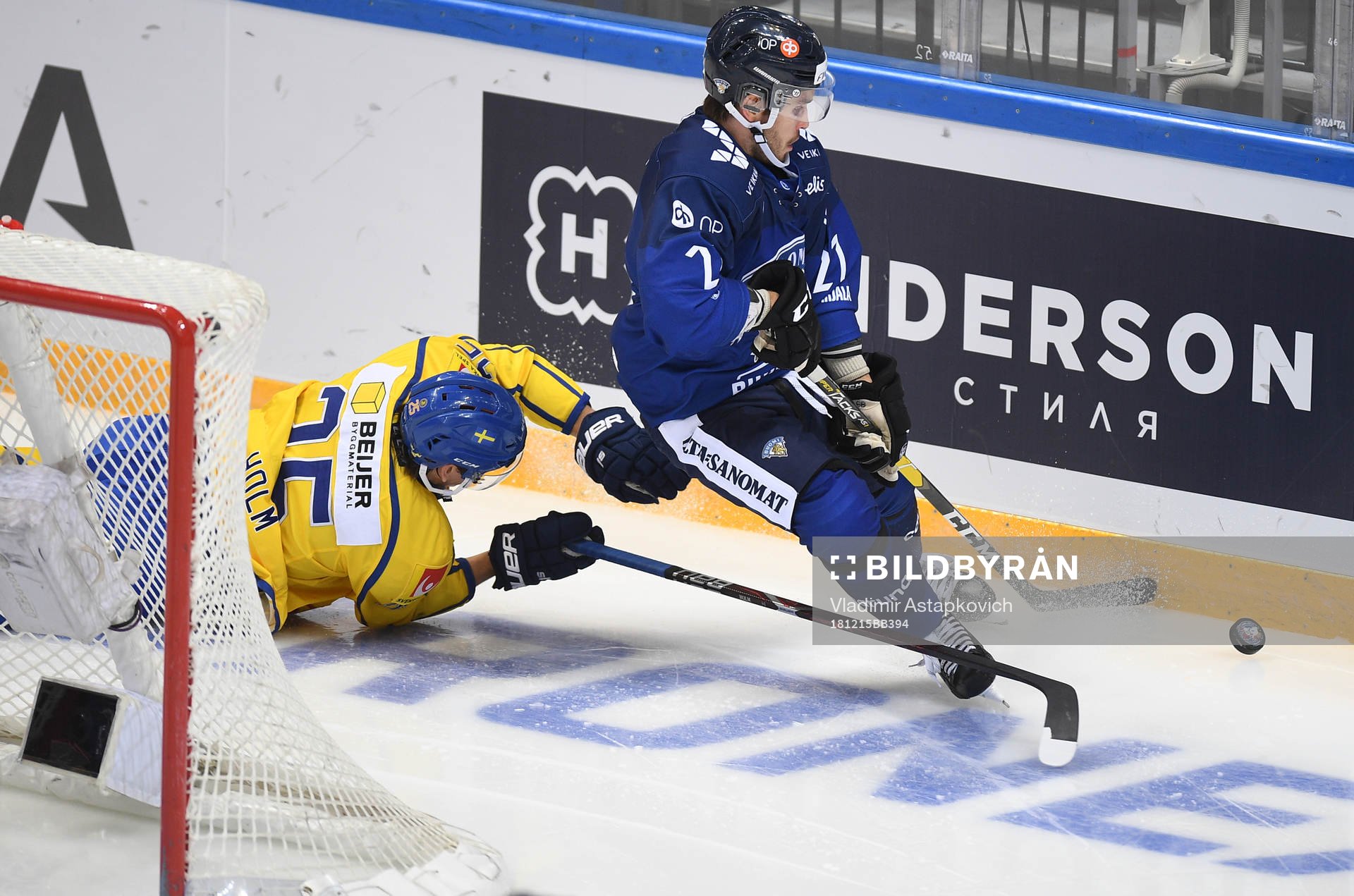 Sweden's Philip Holm, left, falls