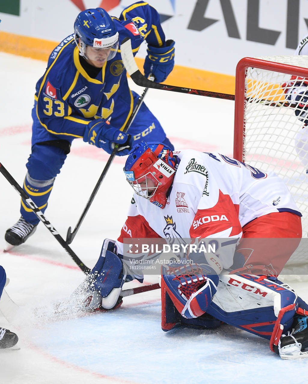 Sweden's Michael Lindqvist, top, scores team's victory goal