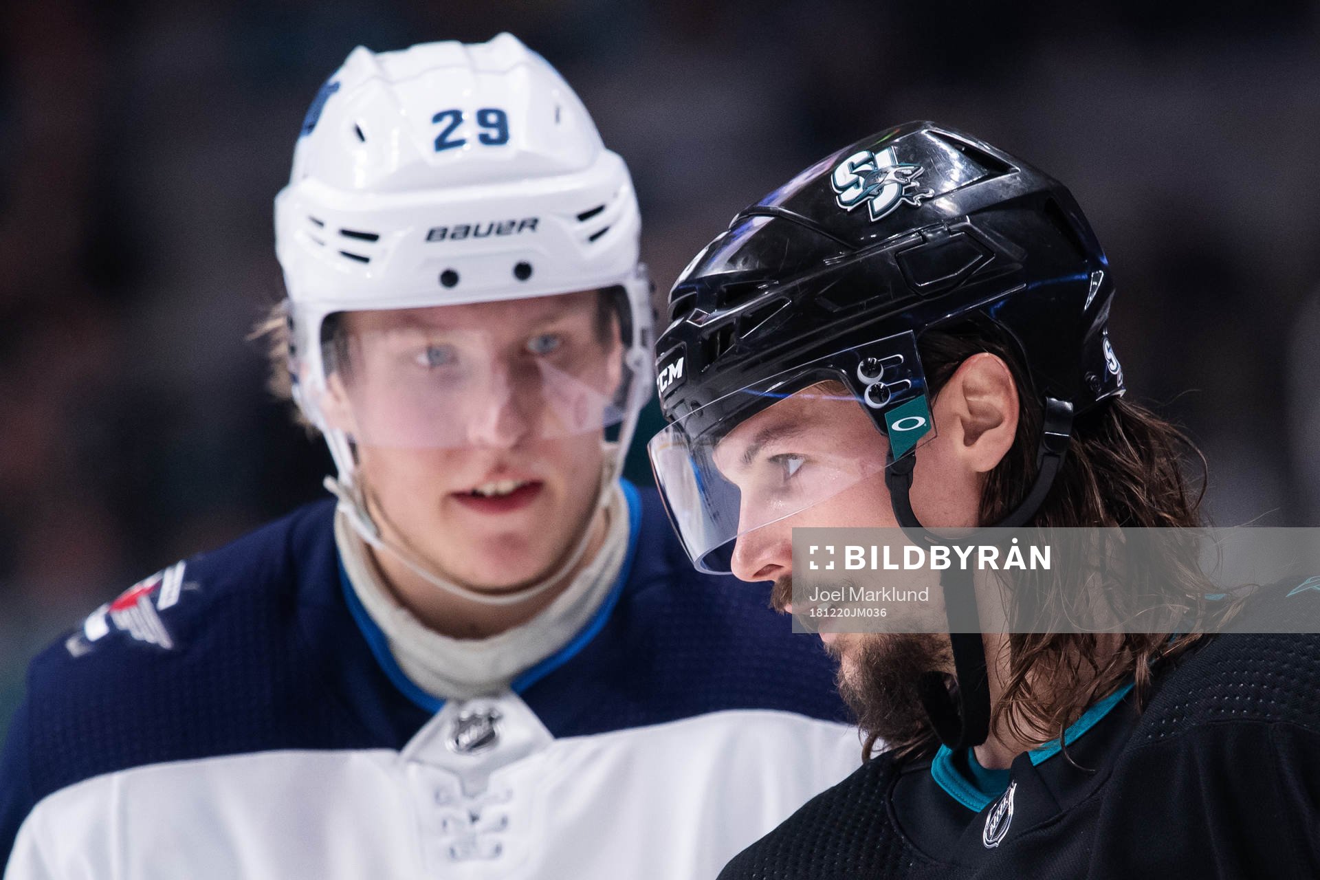 Patrik Laine of Winnipeg Jets and Erik Karlsson of San Jose