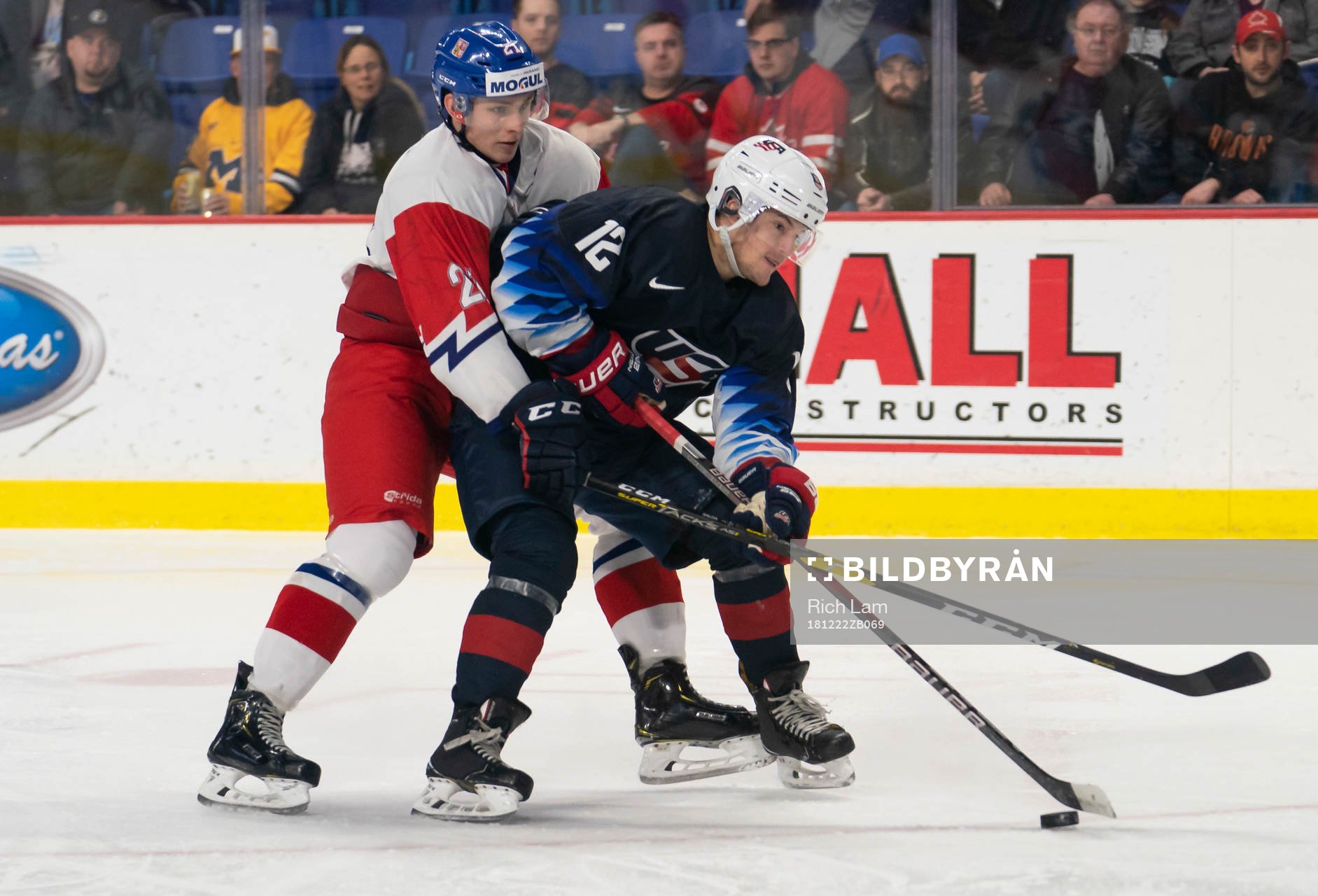 Radim Salda #21 of the Czech Republic tries to tie up Logan