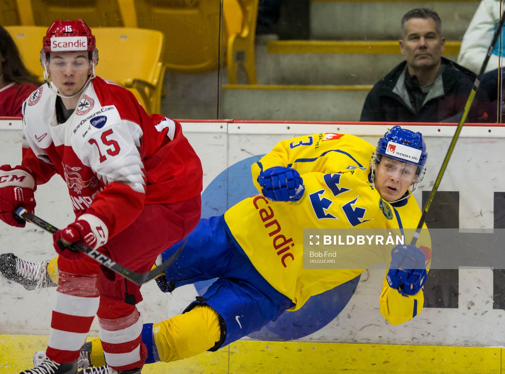 Denmark forward Oliver Reuter (15) checks Sweden defenceman