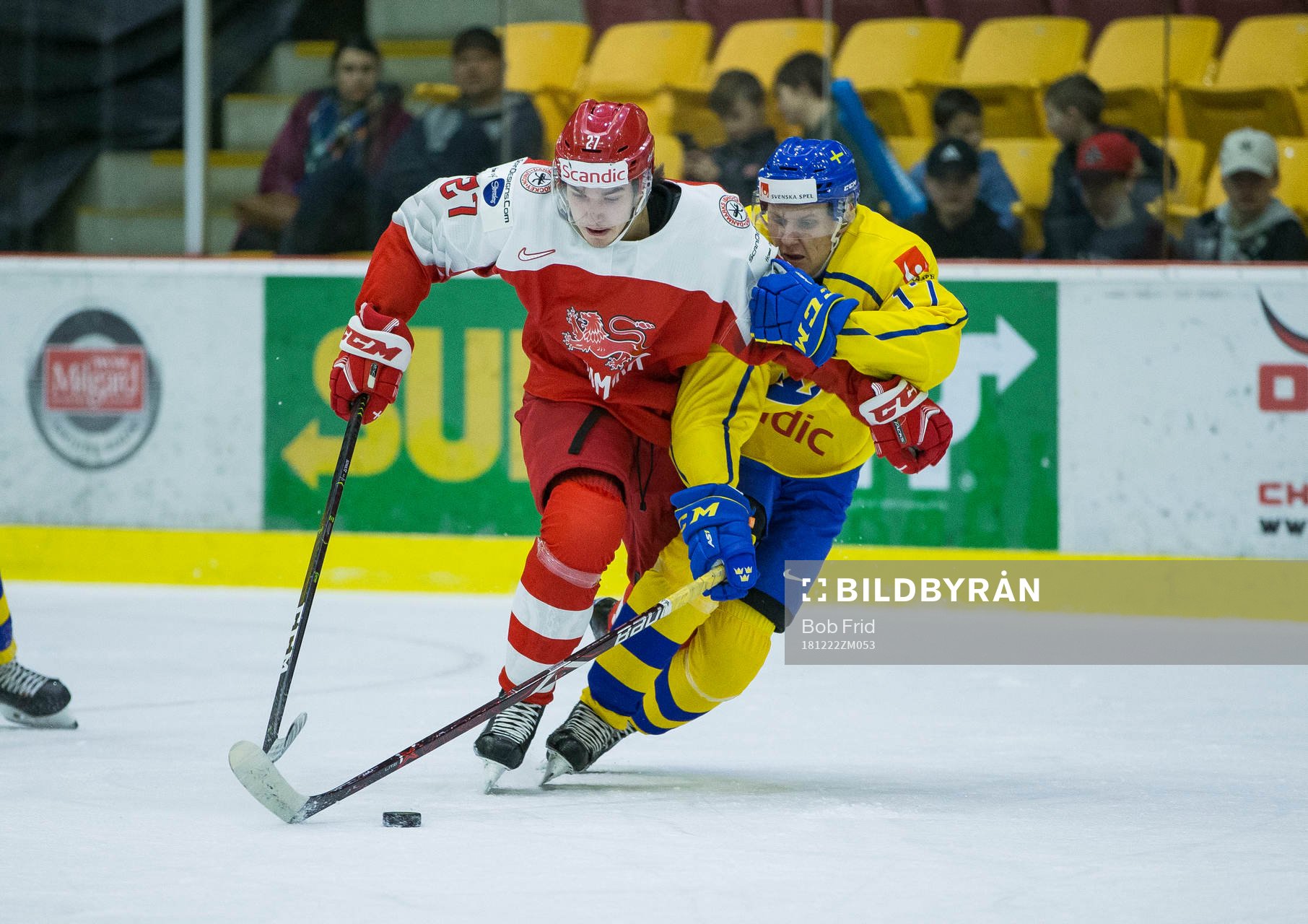 Sweden forward Filip Sveningsson (17)  checks Denmark