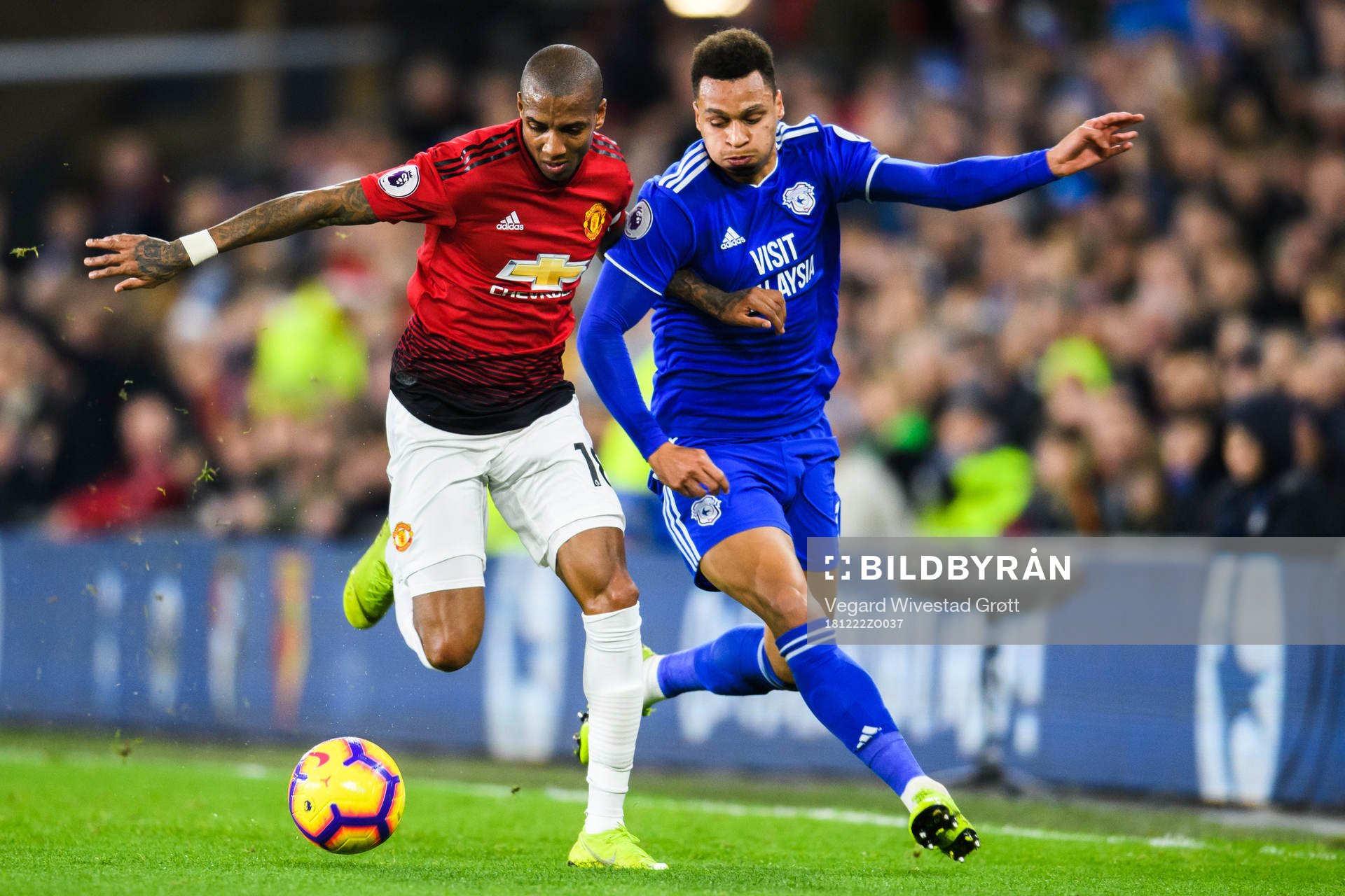 Ashley Young of Manchester United and Josh Murphy of Cardiff
