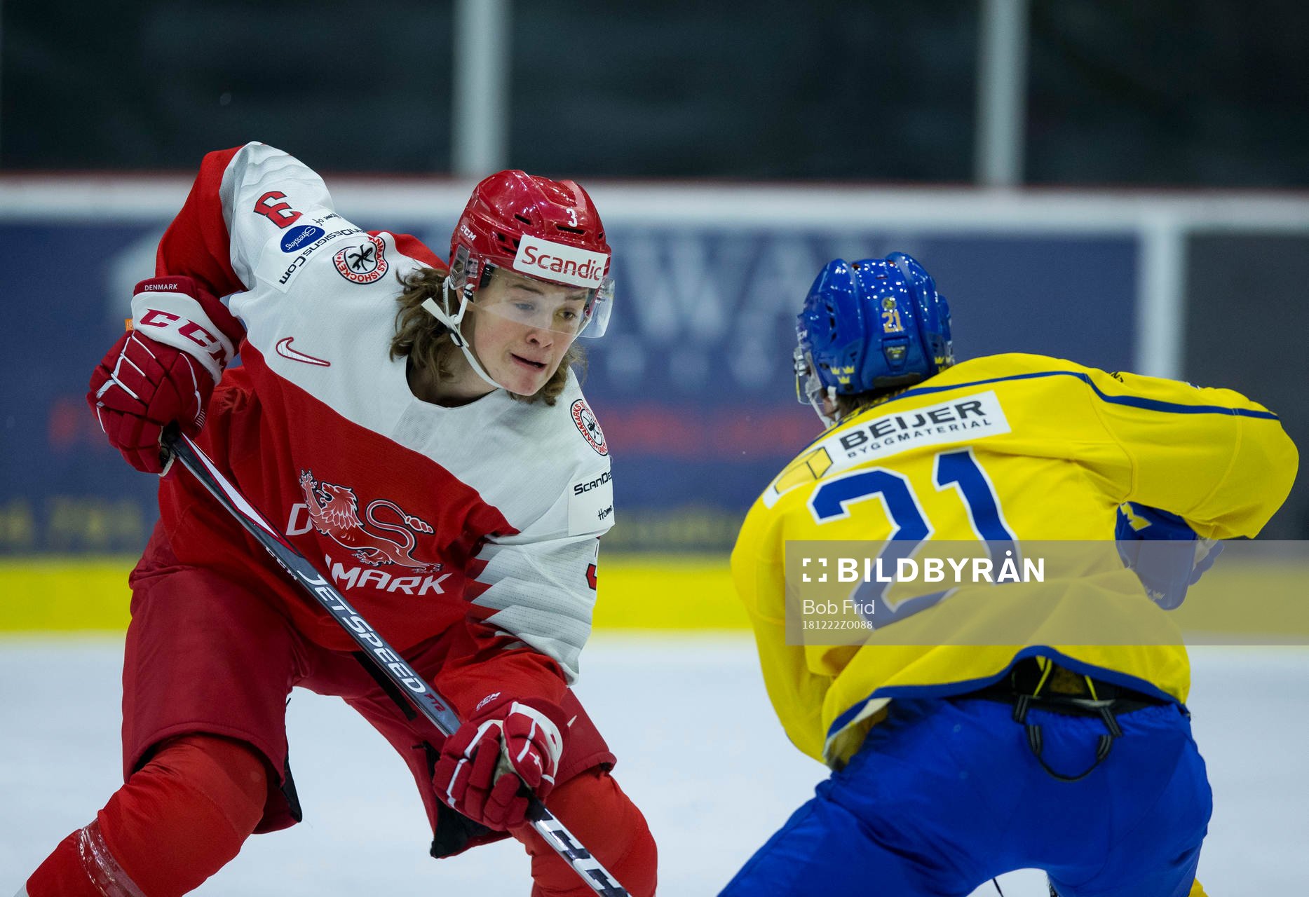 Denmark defenceman Malte Setkov (3) checks Sweden forward