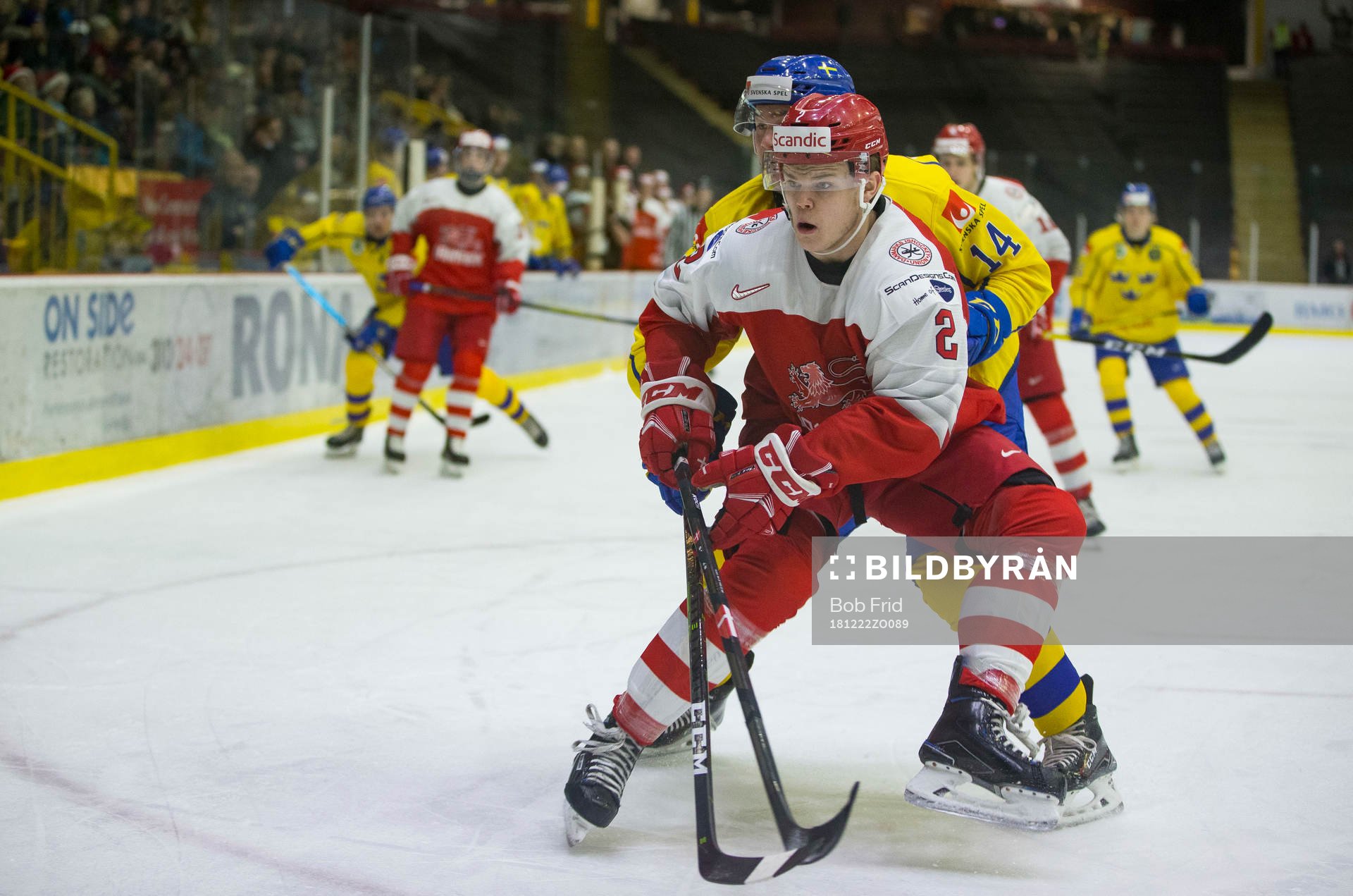 Sweden forward Hugo Leufvenius (14)  checks Denmark