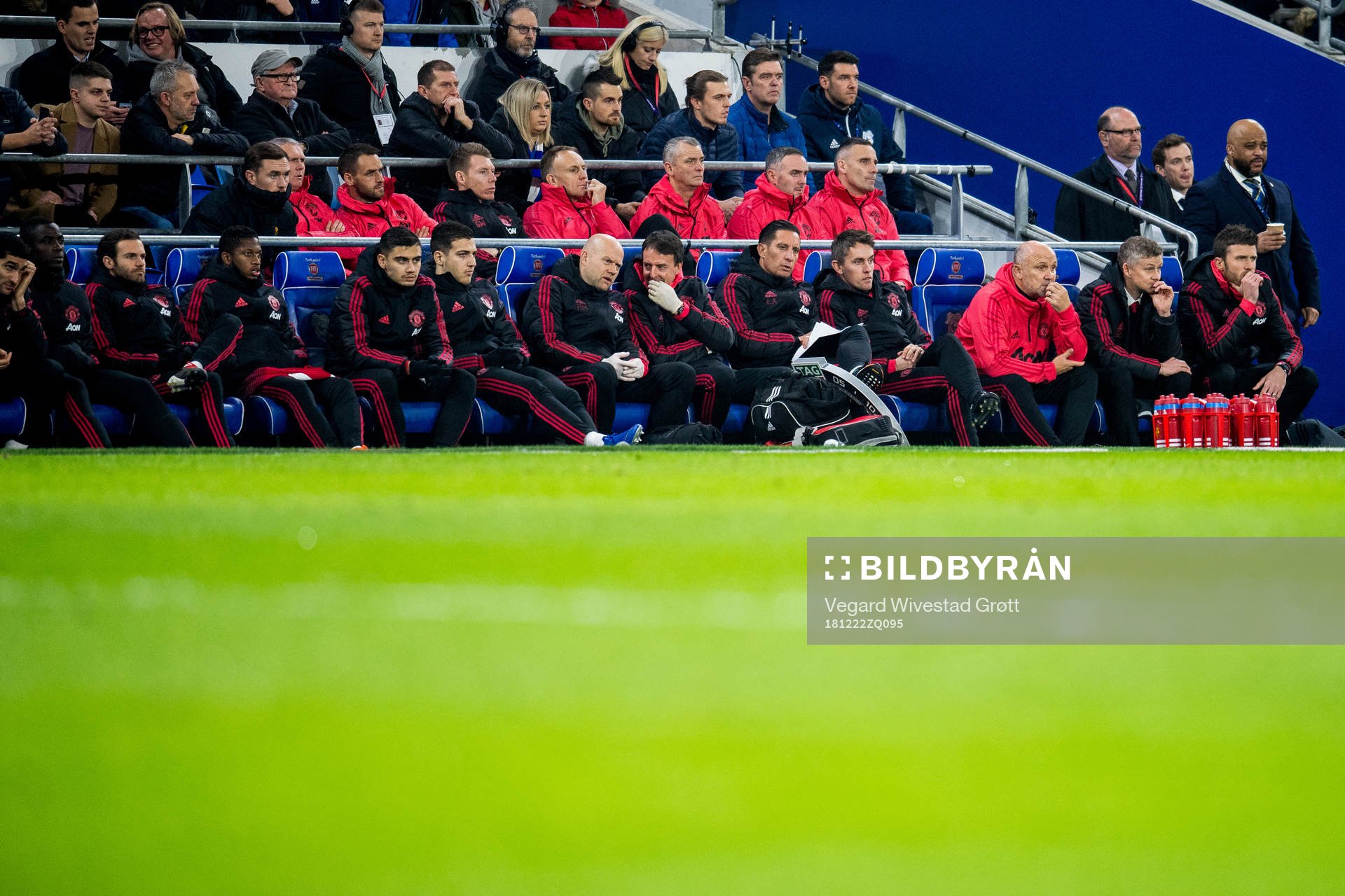Juan Mata, Andreas Pereira, Emilio Alvarez, Kieran McKenna, Mike Phelan, Ole Gunnar Solskjær and Michael Carrick of Manchester United look on from the bench during the Premier League match between Cardiff and Manchester United on December 22, 2018 in Cardiff.