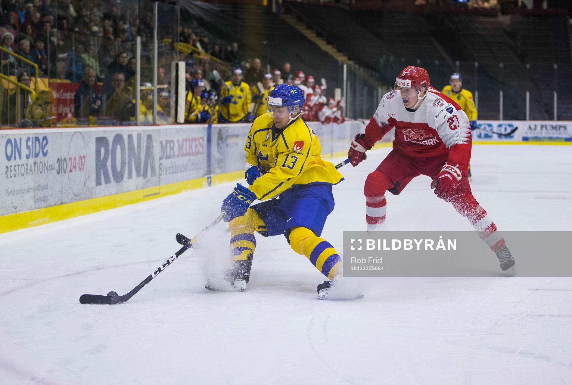 Denmark forward Phillip Schultz (27) checks Sweden forward