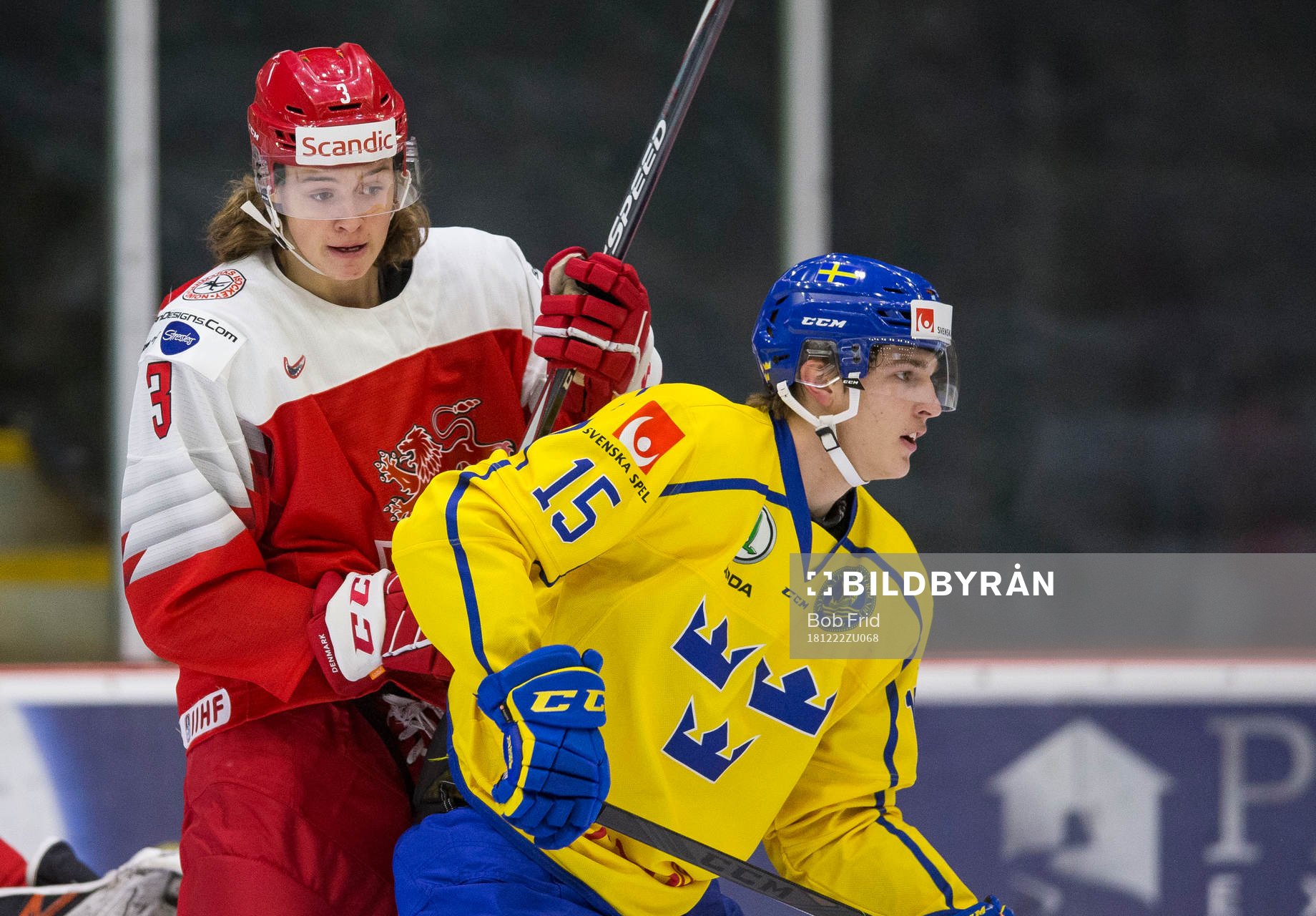 Denmark defenceman Malte Setkov (3)  battles with Sweden