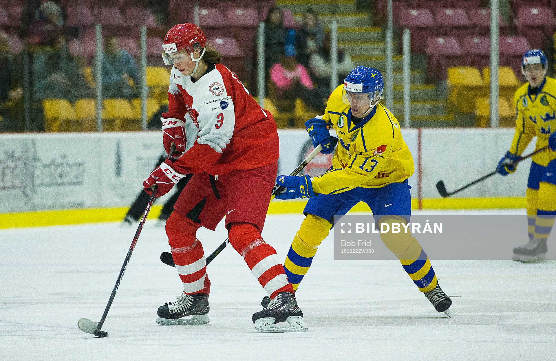 Sweden forward Johan Södergran (13)  checks Denmark