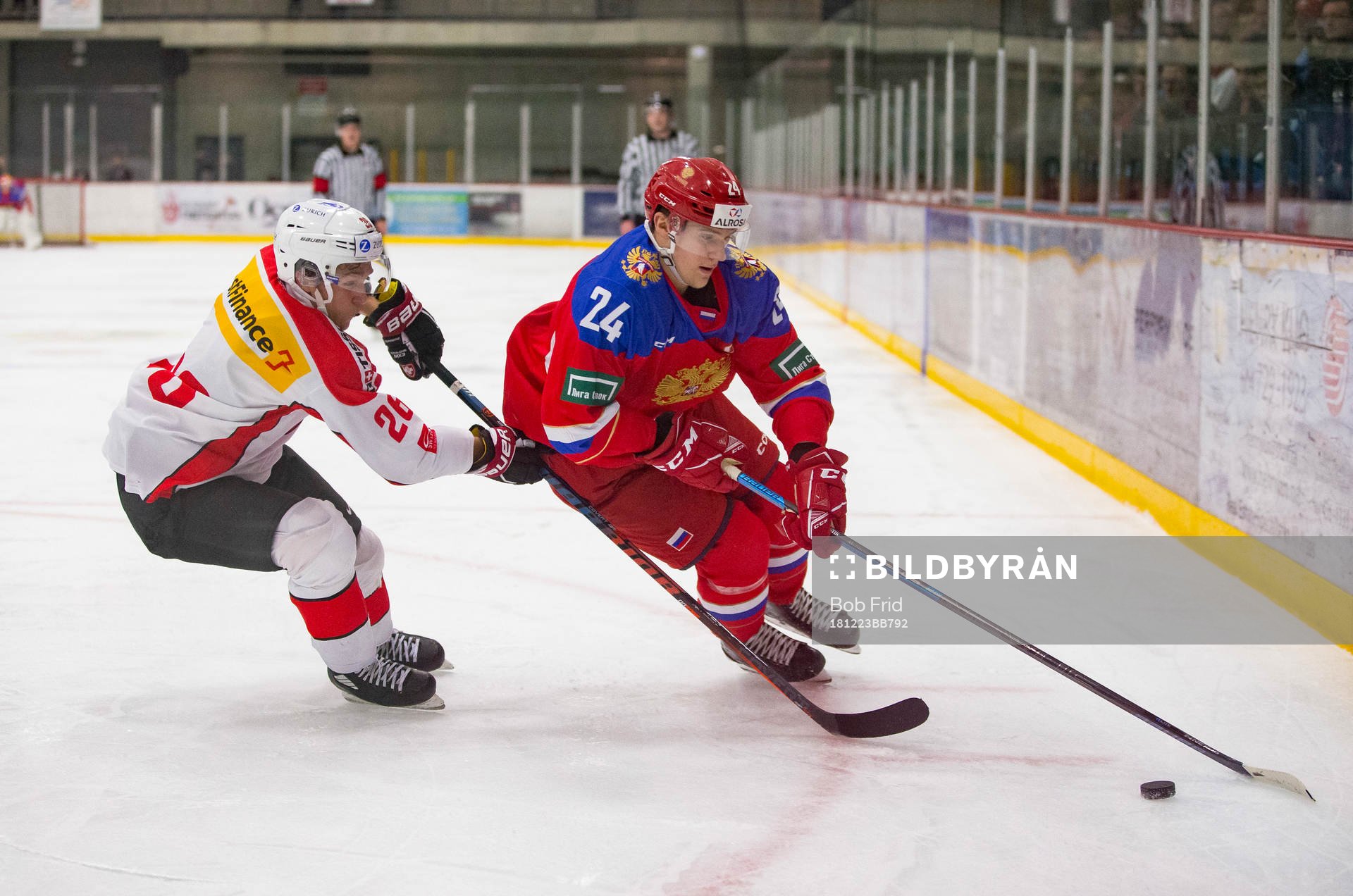 Switzerland defenceman David Aebischer (26)  checks Russia