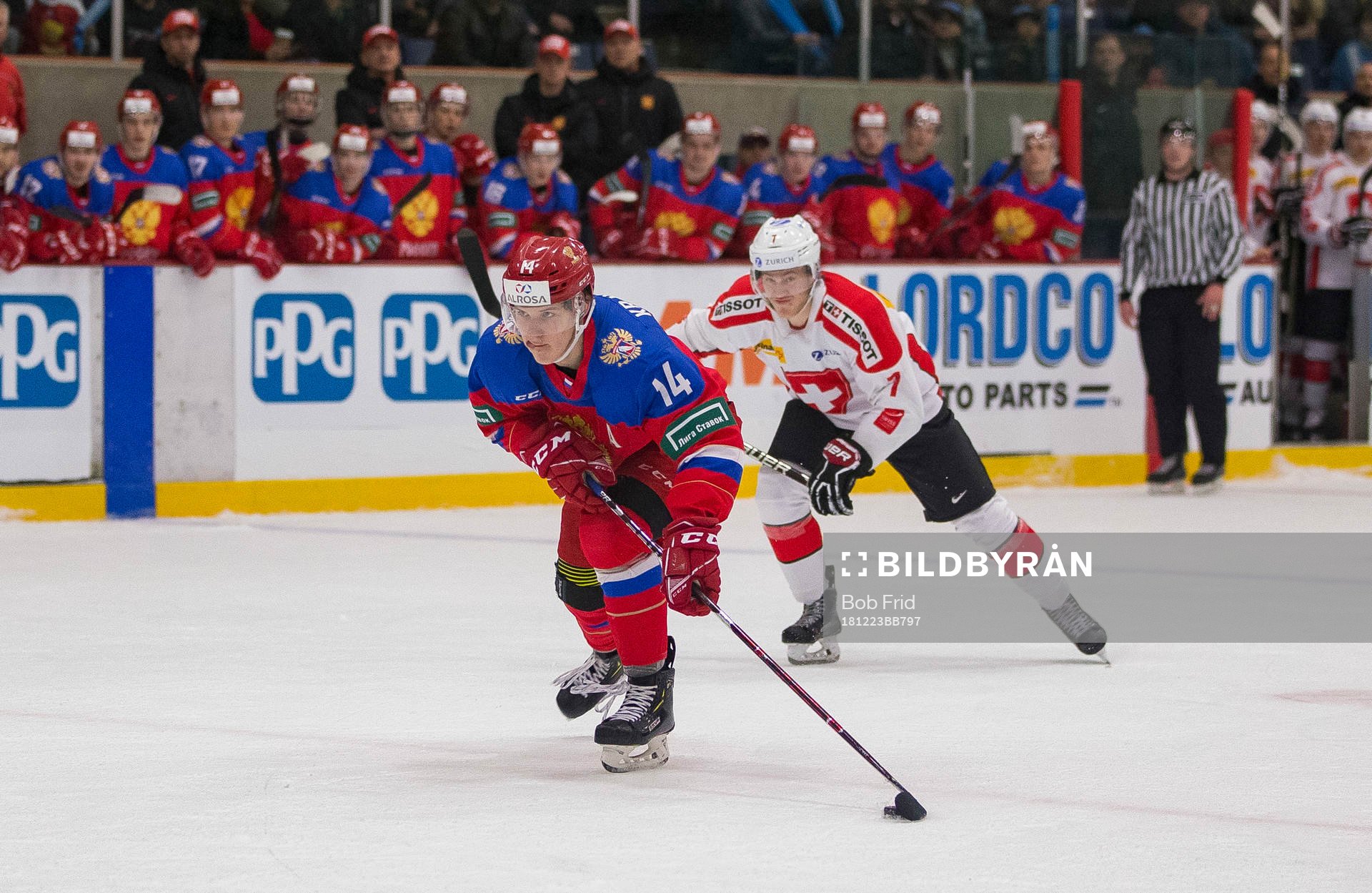 Russia forward Vitalii Kravtsov (14) breaks in