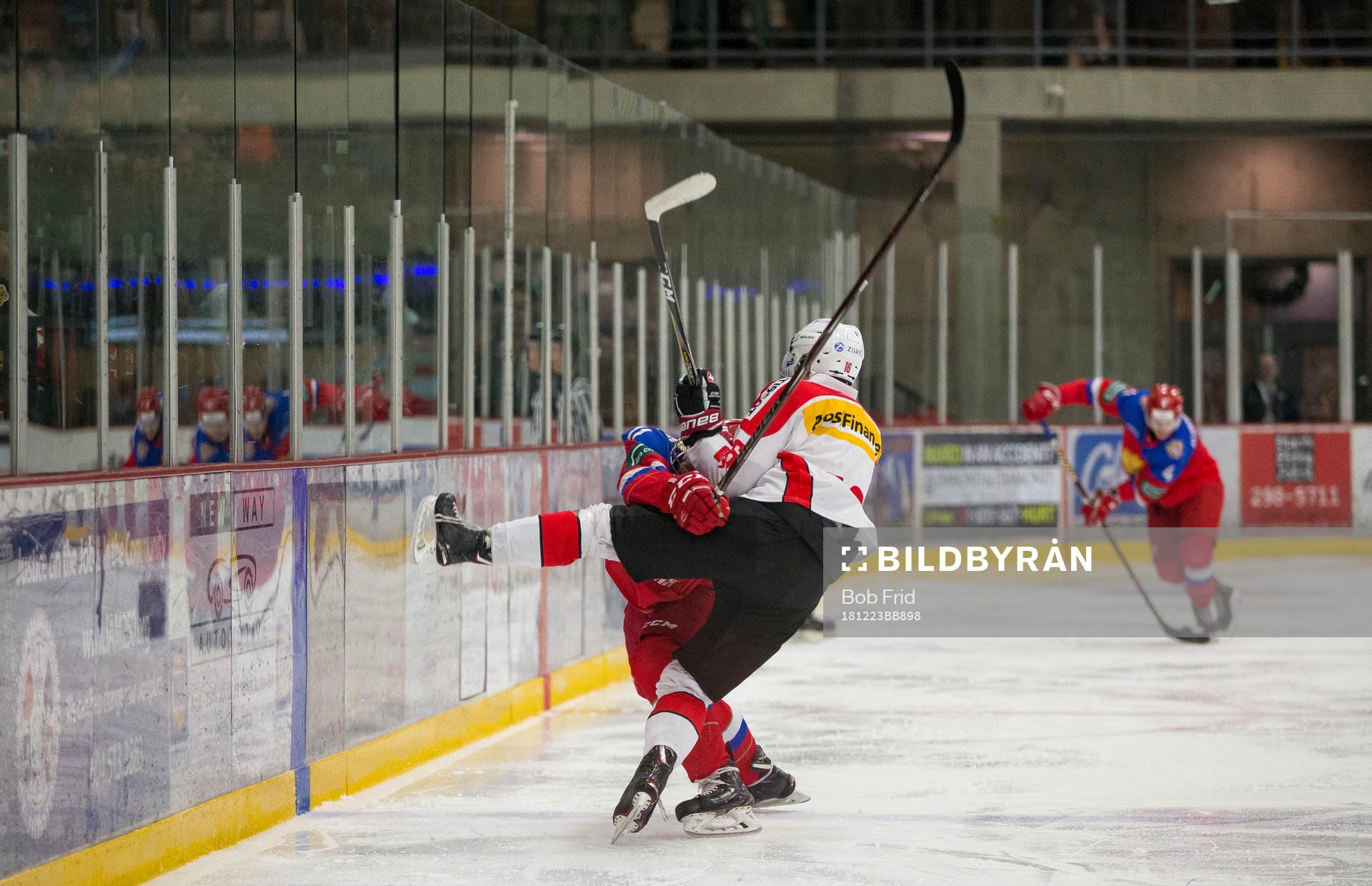 Switzerland defenceman Nico Gross (16) checks Russia