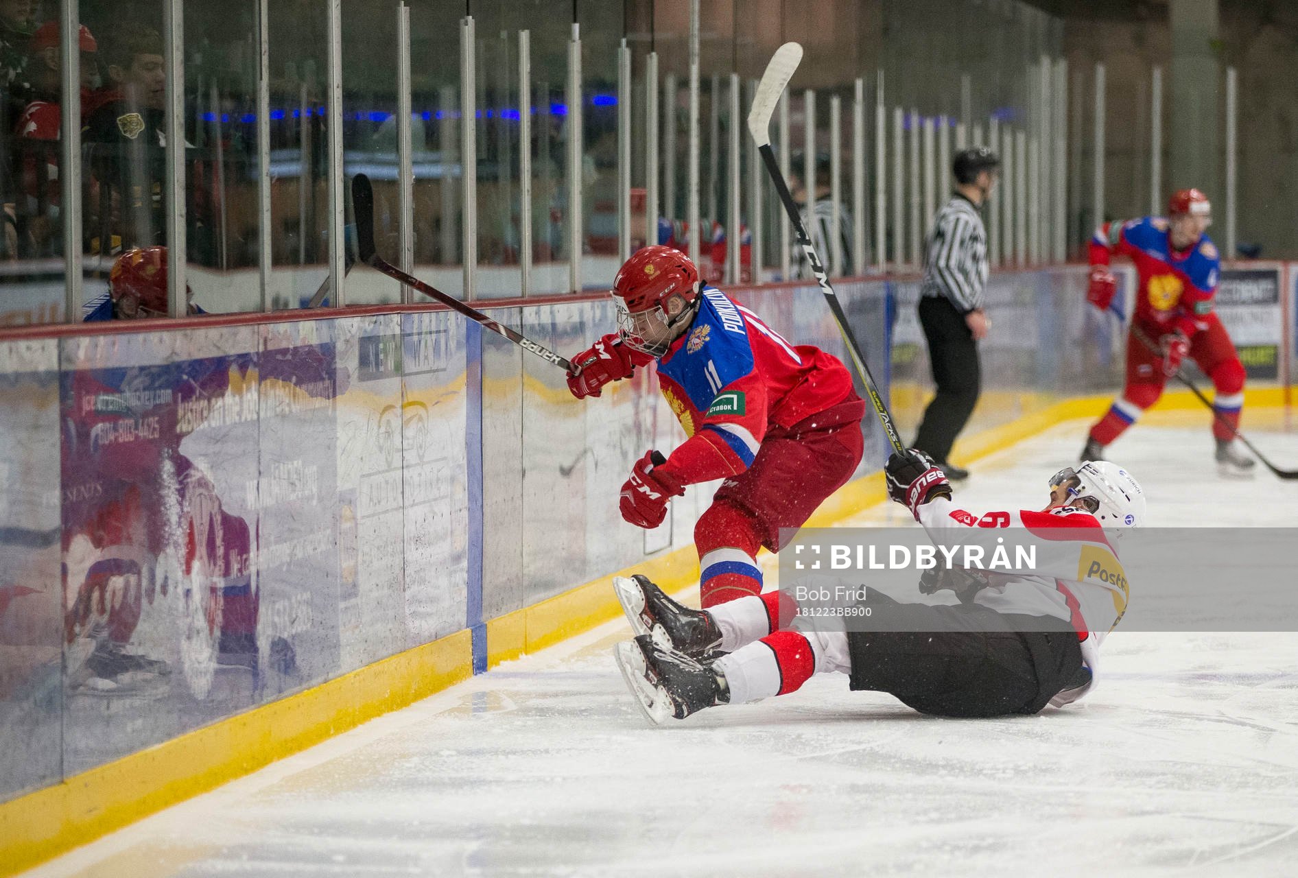Switzerland defenceman Nico Gross (16) checks Russia