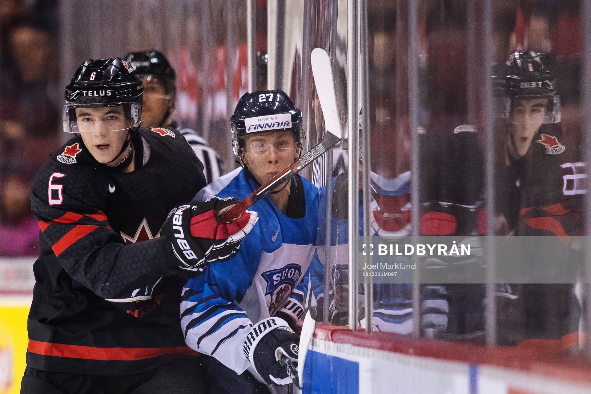 Noah Dobson of Canada and Jesse Ylönen of Finland