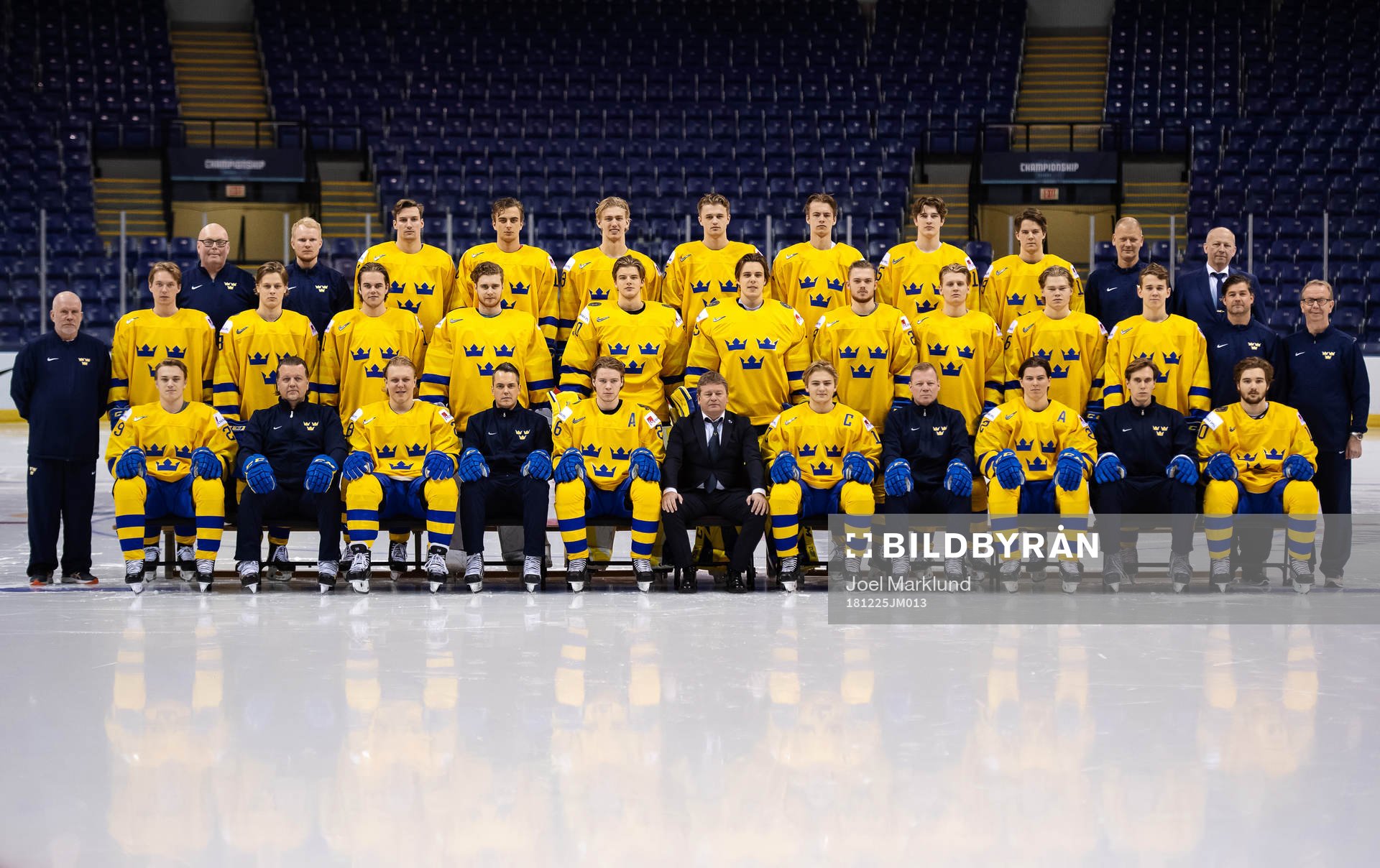 Players and coaching staff of team Sweden pose for an