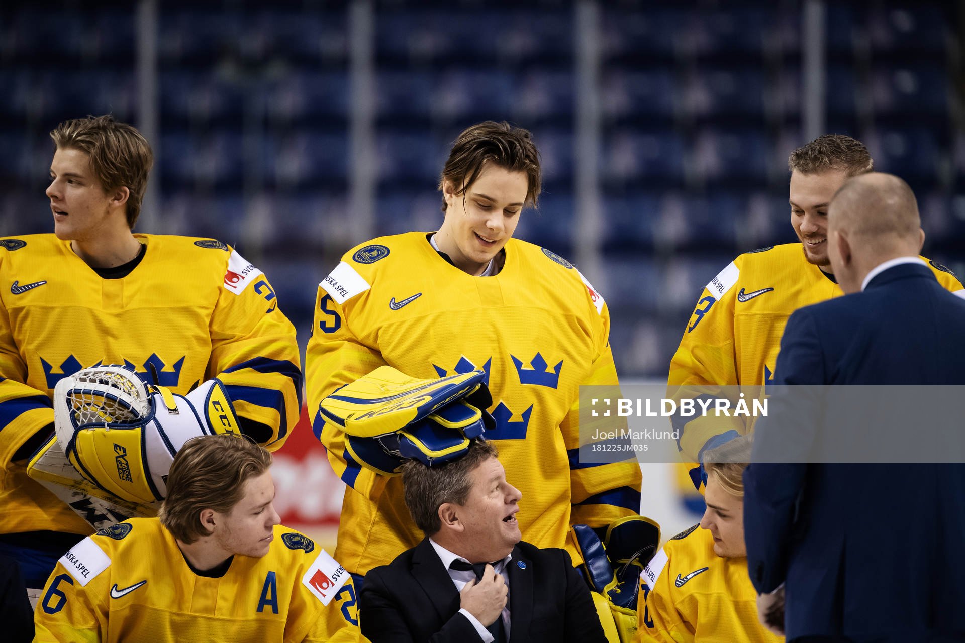 Goaltender Olle Eriksson Ek plays with team manager Jonas