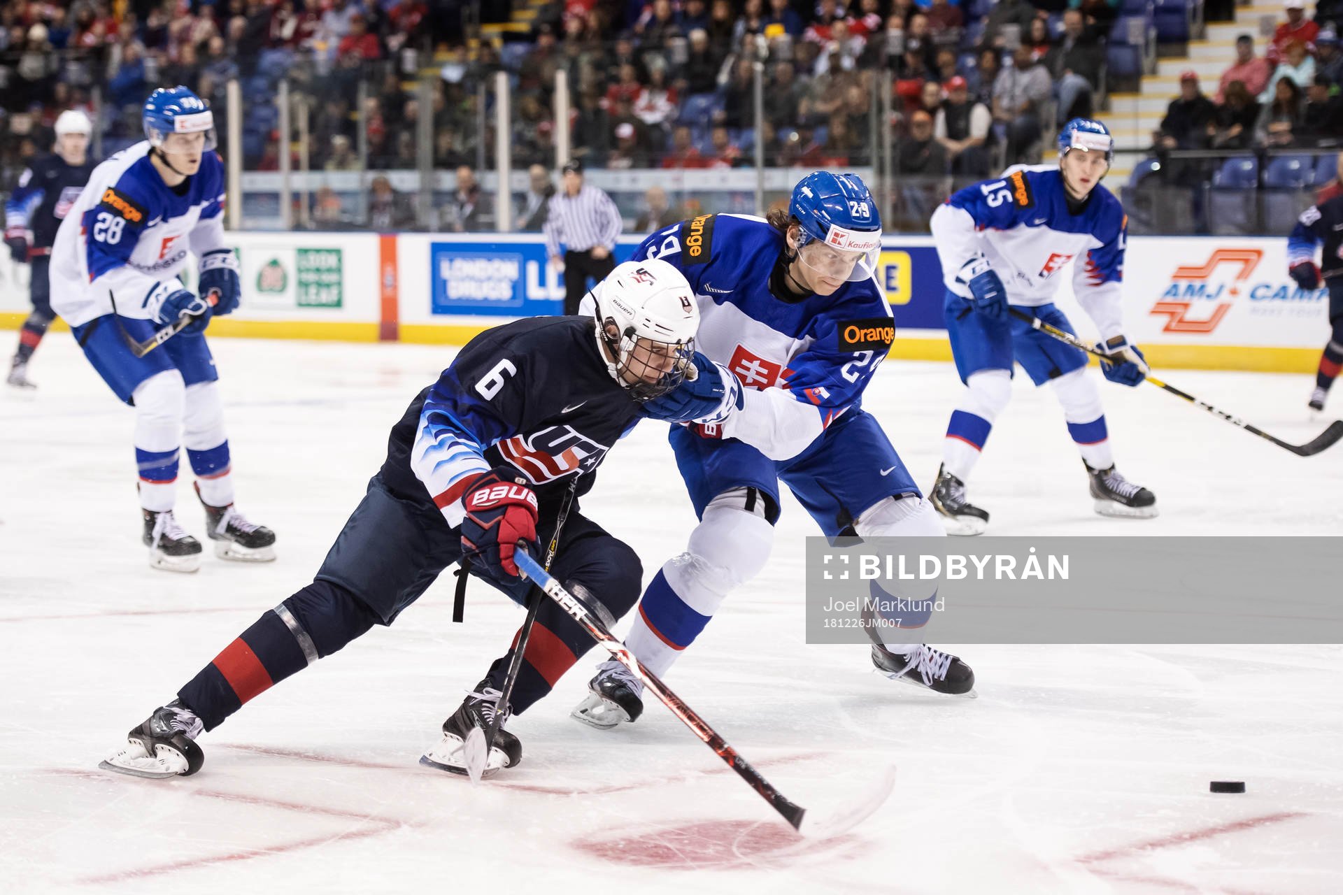 Jack Hughes of USA challenges Michal Ivan of Slovakia