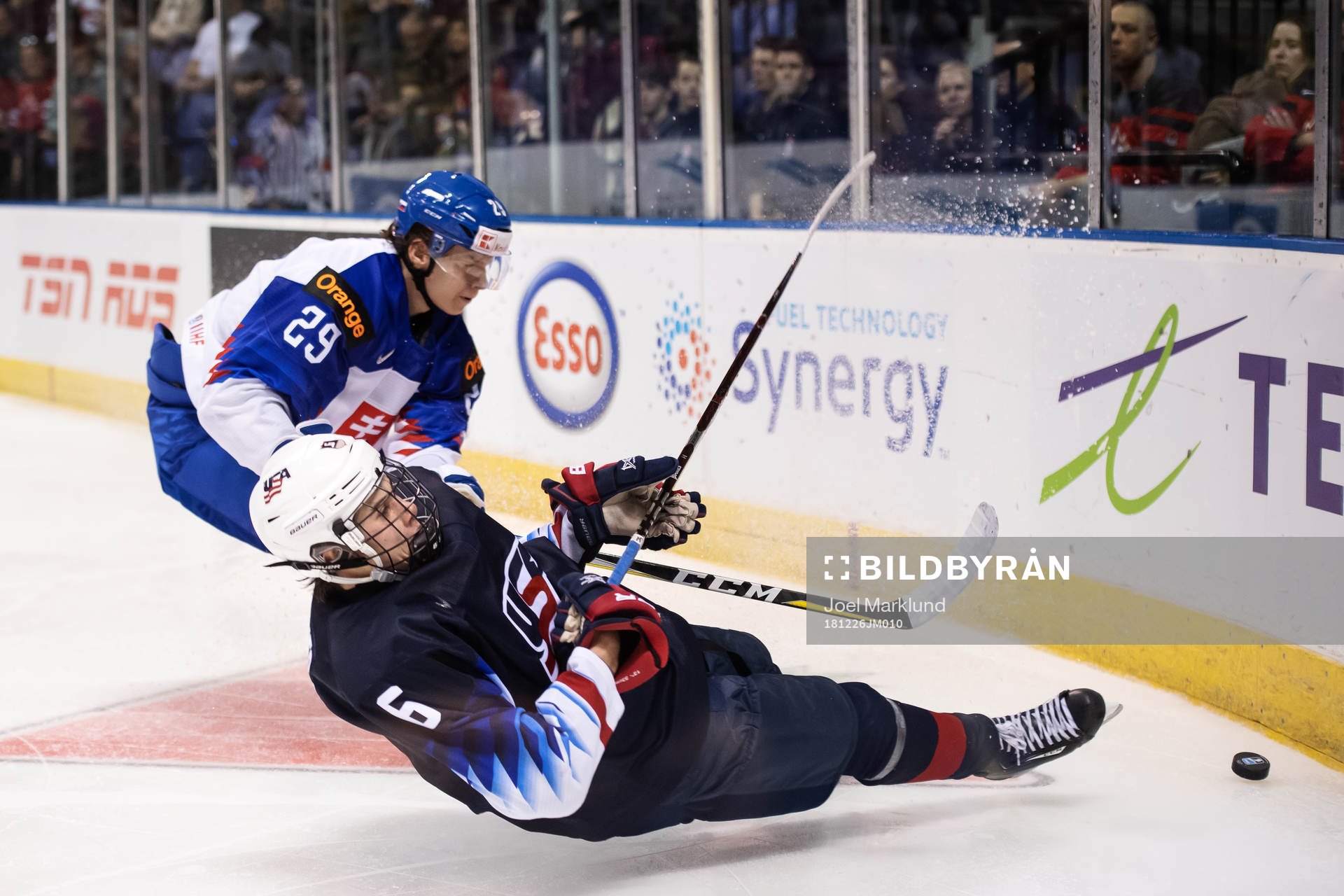 Jack Hughes of USA falls in action against Michal Ivan of