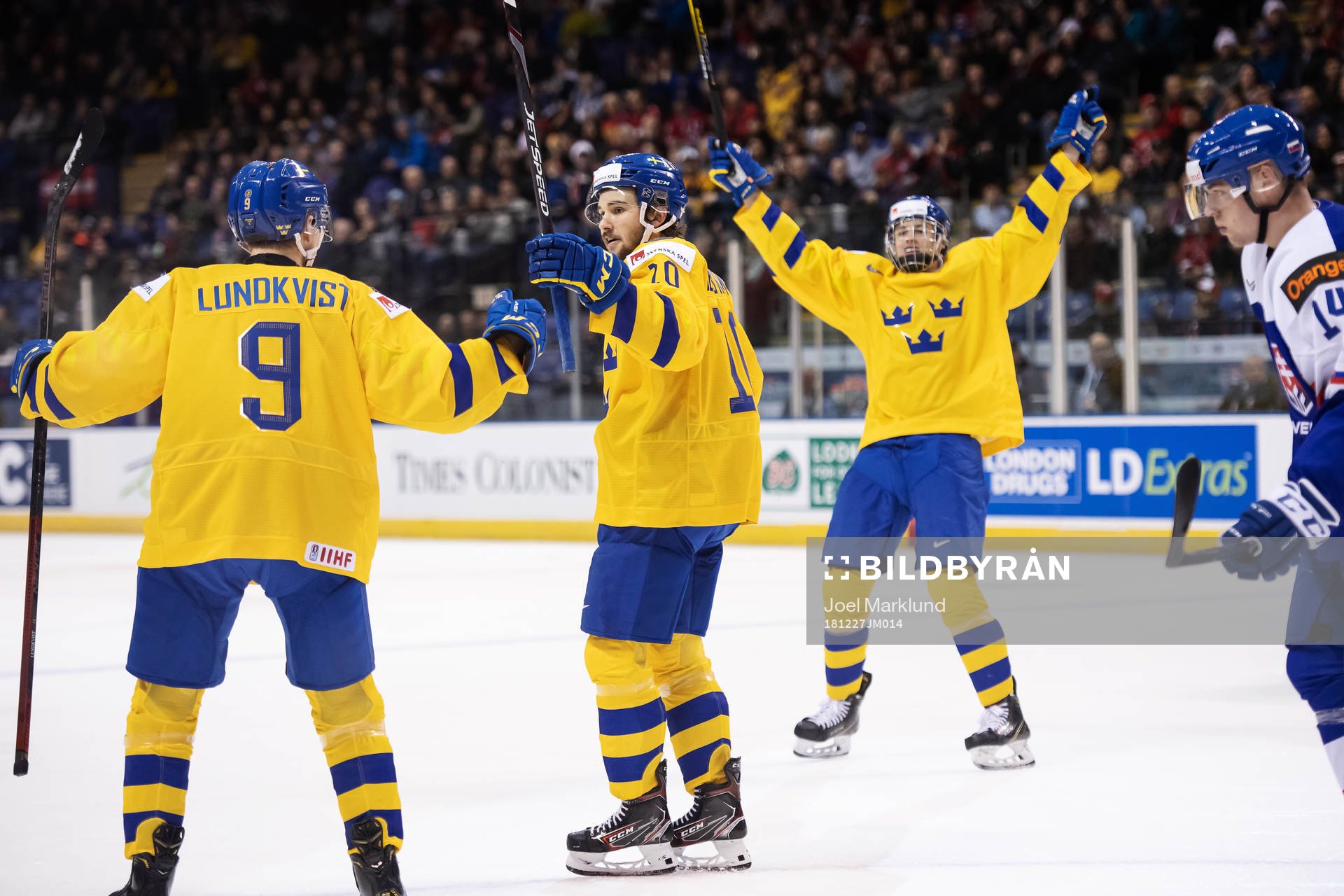 Emil Bemström (C) of Sweden celebrates