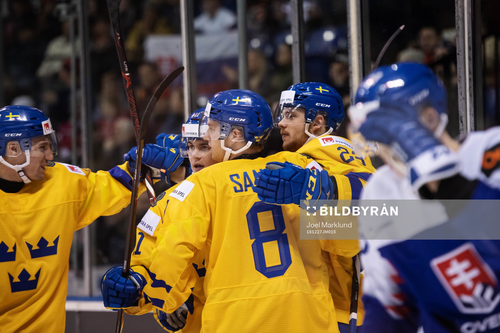 Lucas Elvenes (R) of Sweden celebrates with teammates