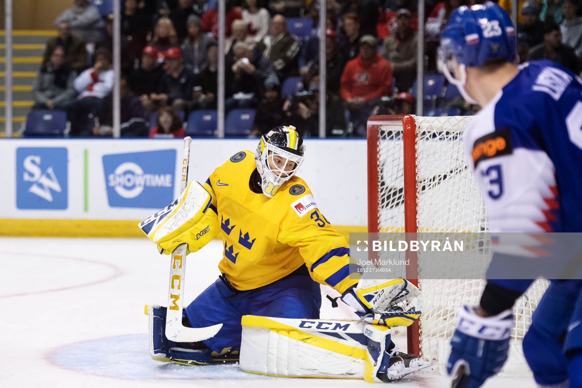 Goaltender Samuel Ersson of Sweden makes a save
