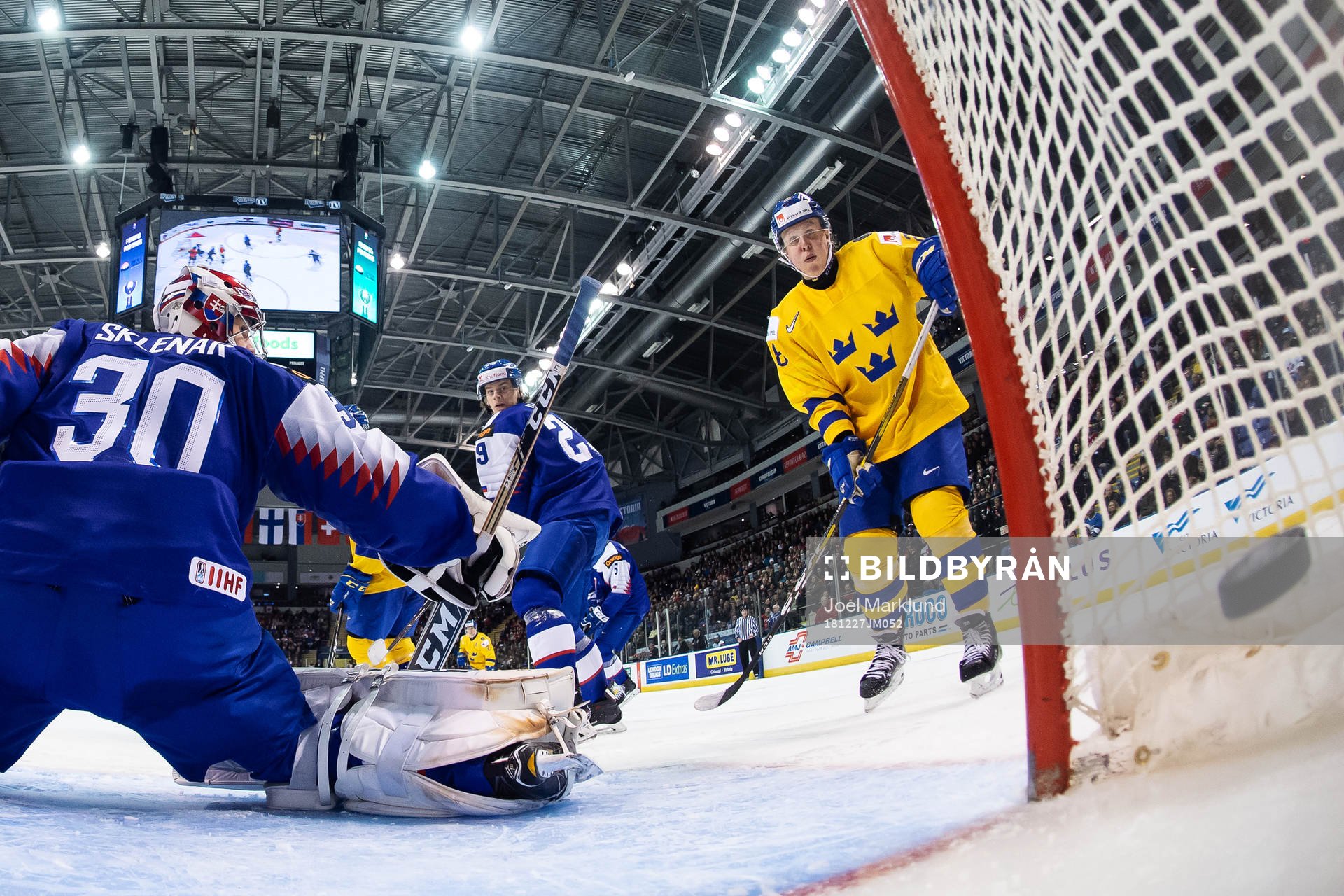 Fabian Zetterlund of Sweden sees the puck shot by Erik