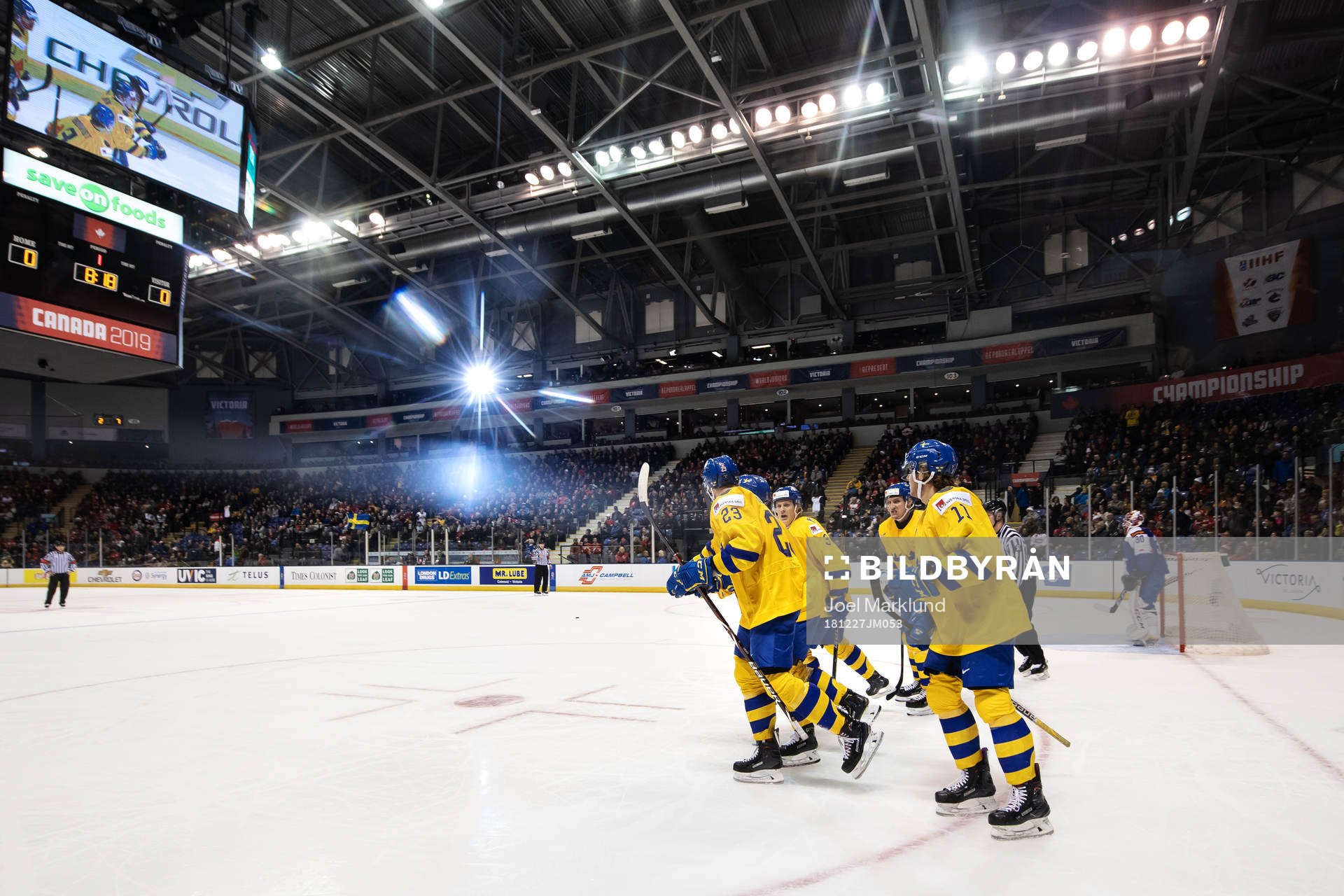 Lucas Elvenes (L) of Sweden celebrates with teammates